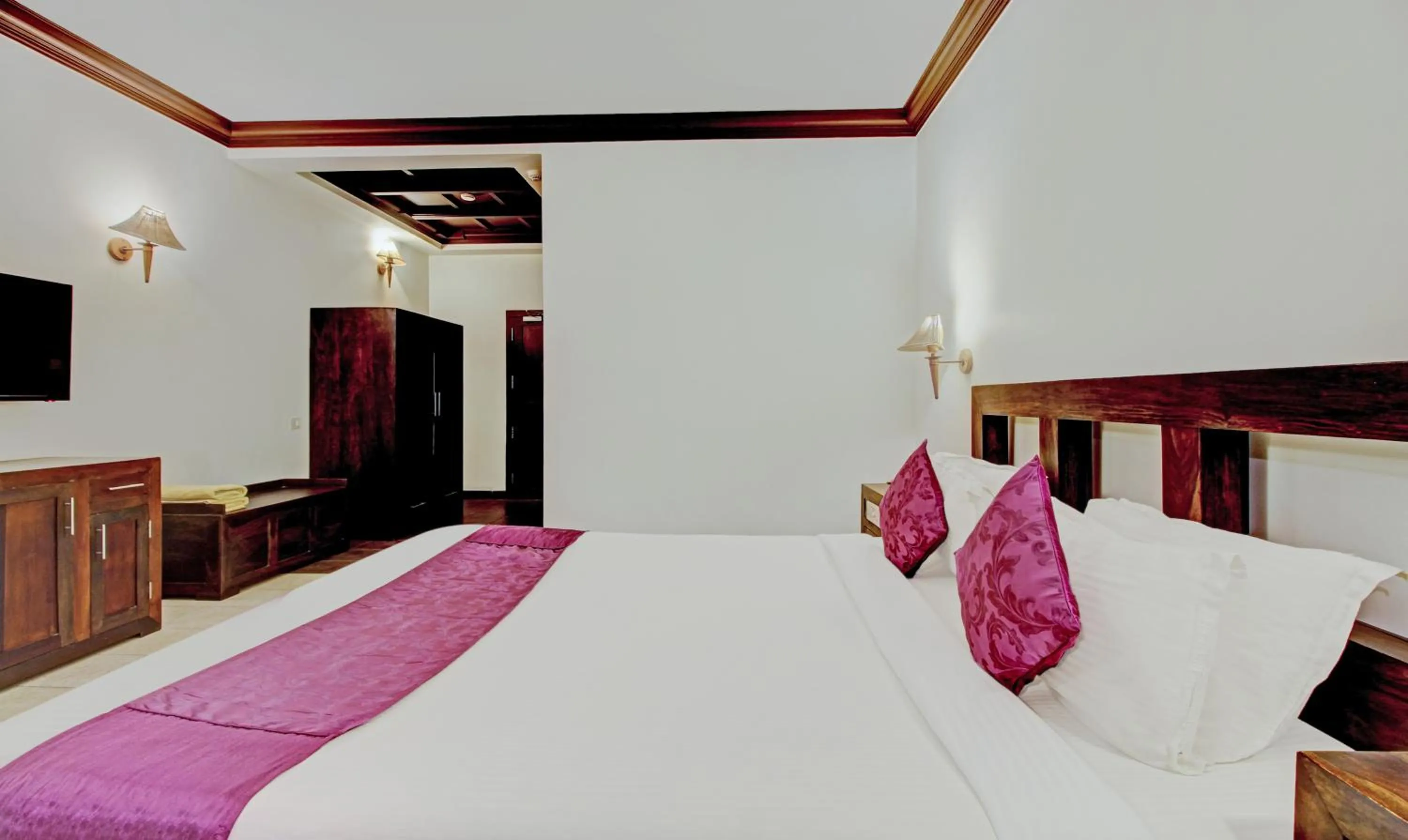 Bedroom, Bed in Treebo Premium Travancore Palace Cherthala