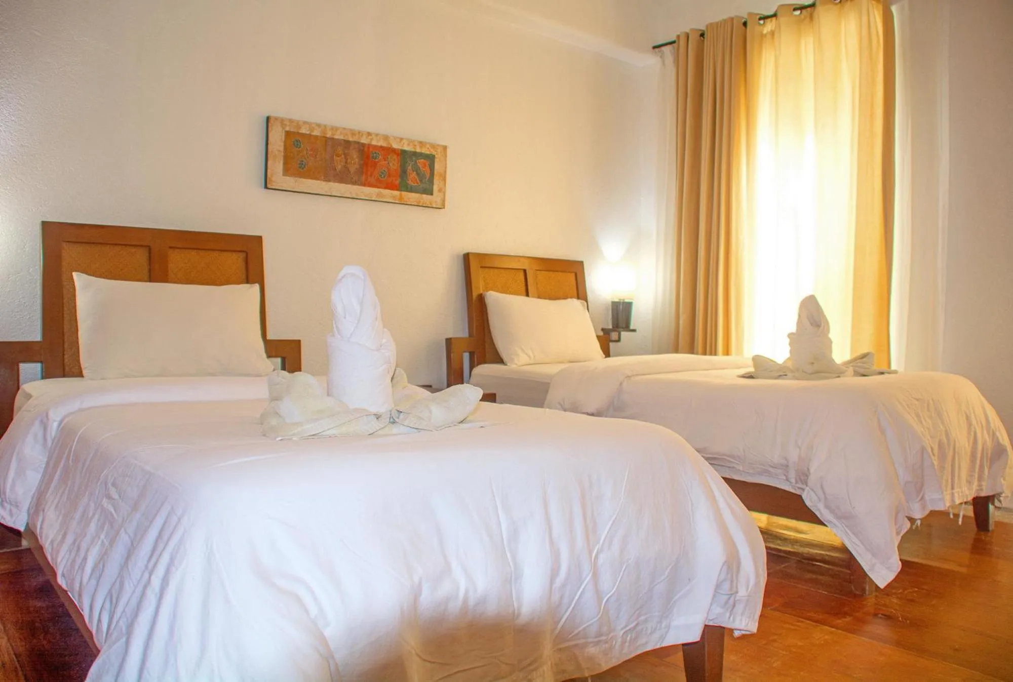 Bed in Mayumi Beach Villa