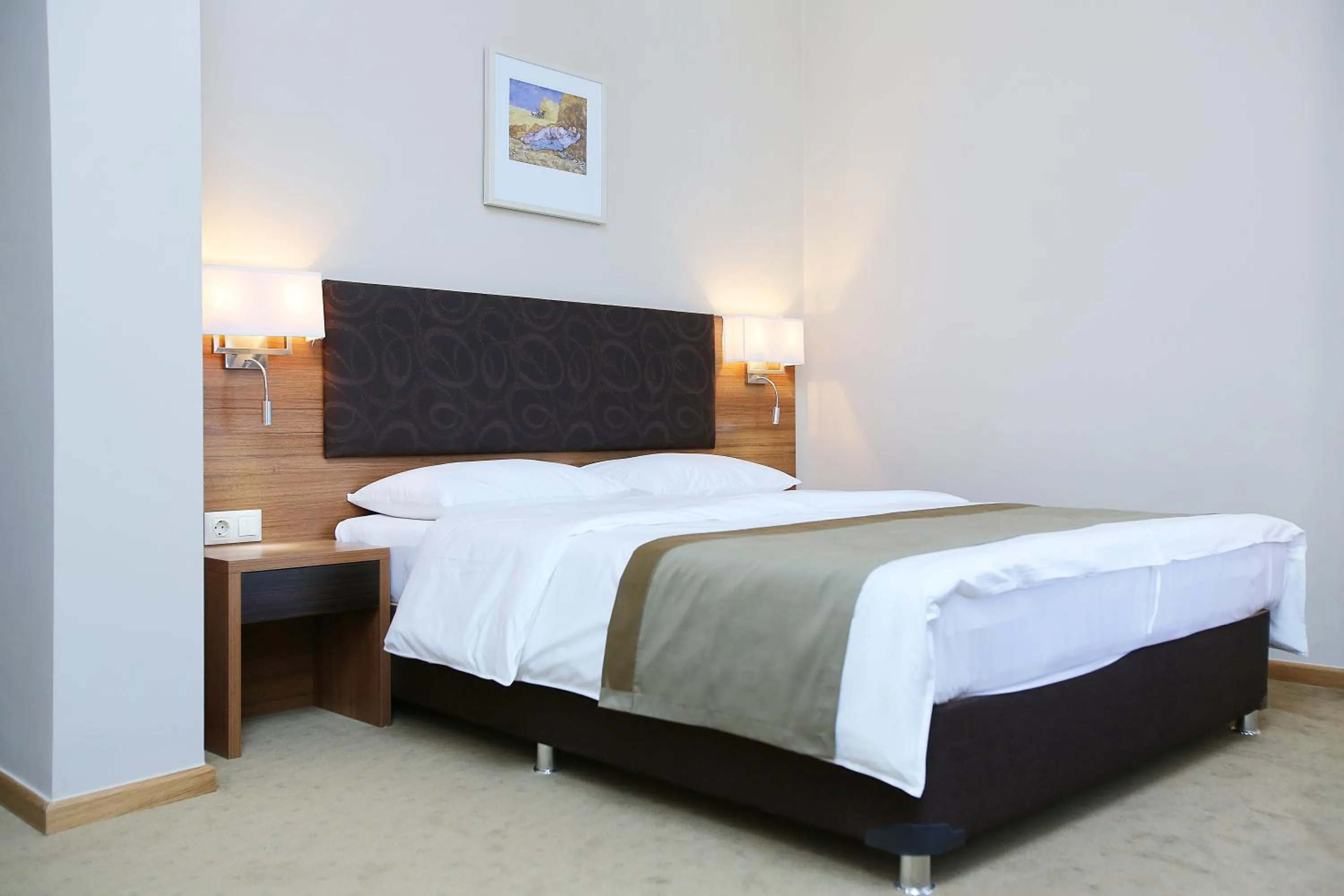 Bed in Tskaltubo Plaza Hotel