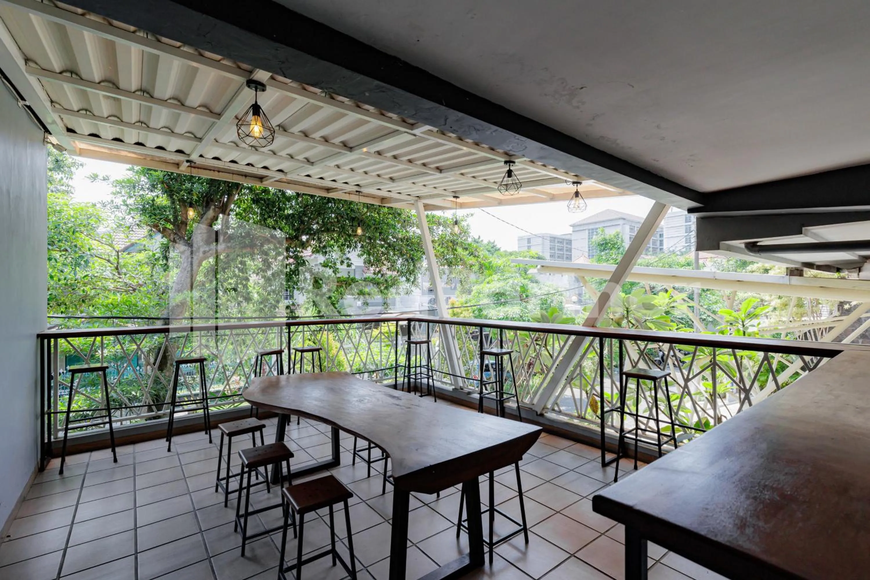 Seating area in De Malang Sweet Homestay Syariah Mitra RedDoorz