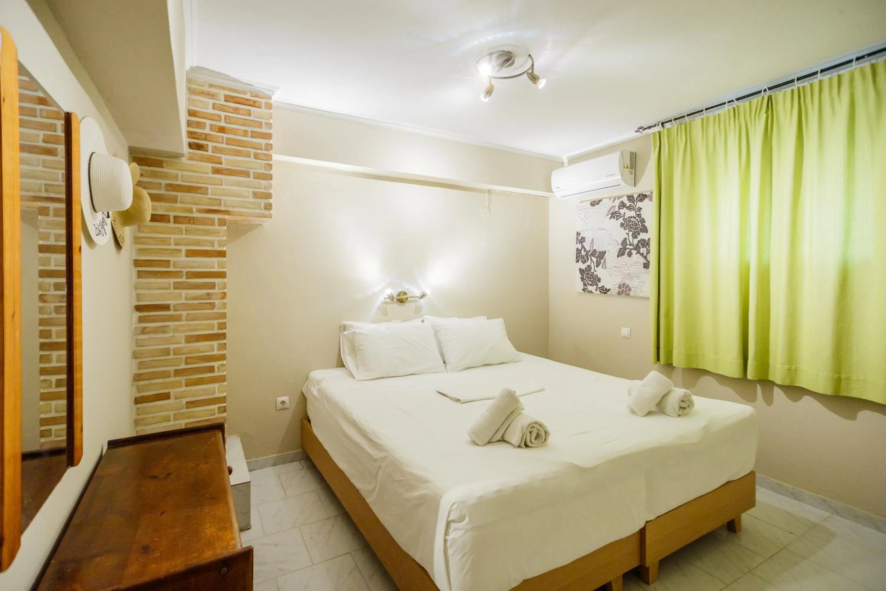 Bed in Rose Club Apartments