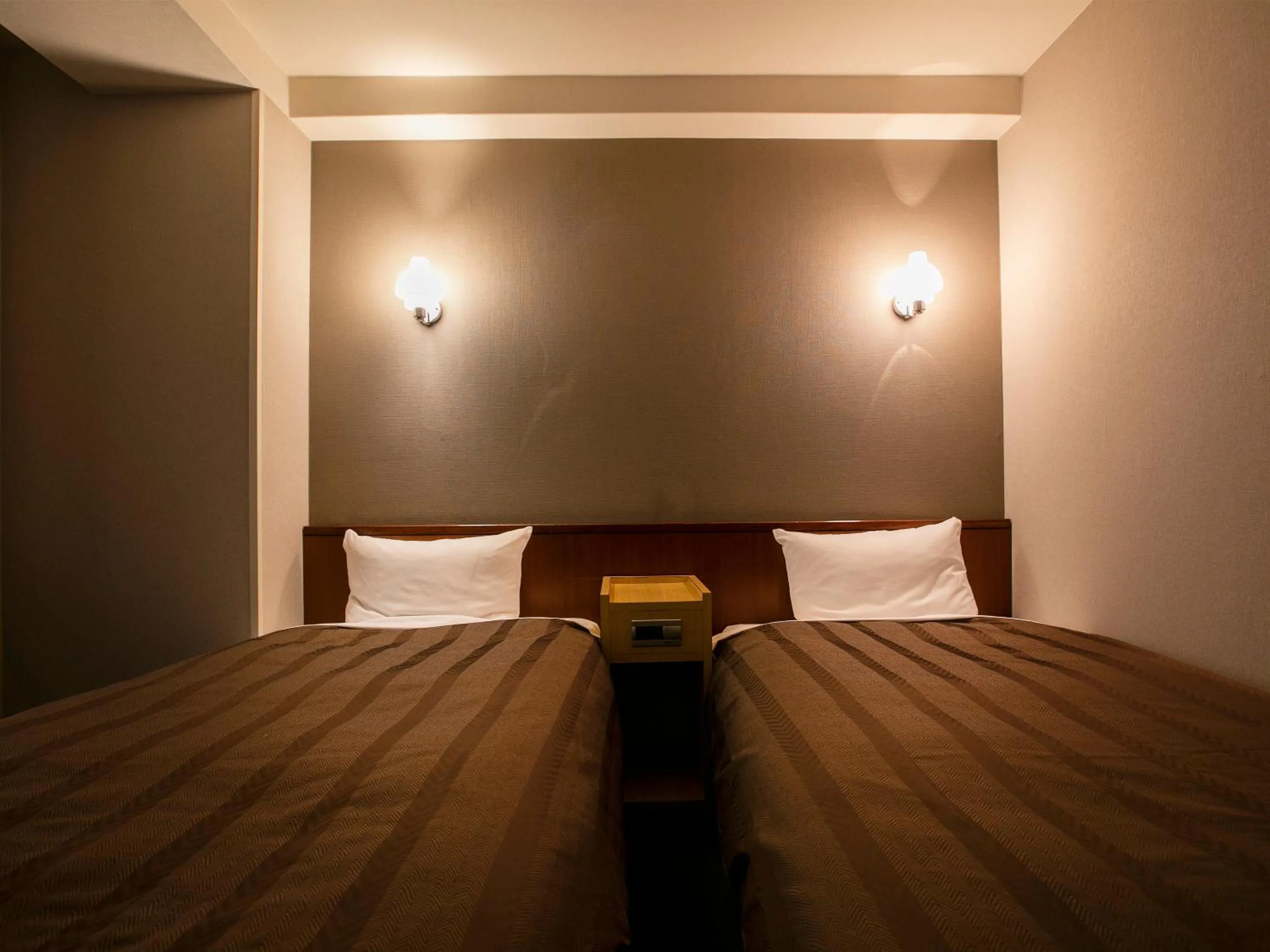 Bed in Hotel New Nishino