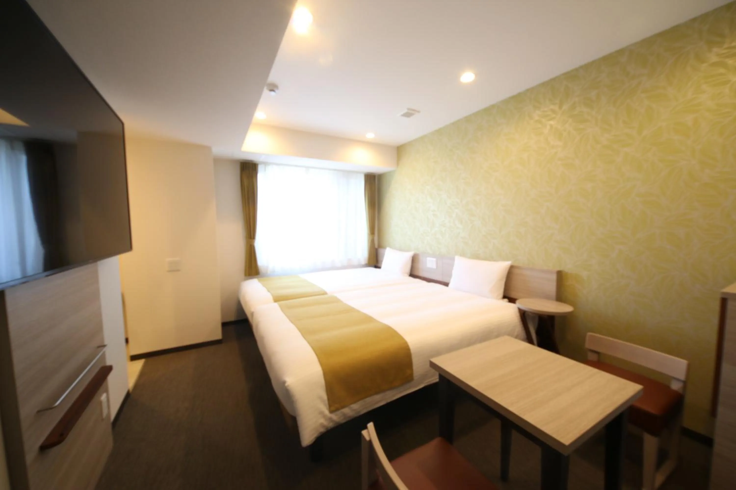 Bed in Kuretake Inn Premium Numazu Kitaguchi Ekimae