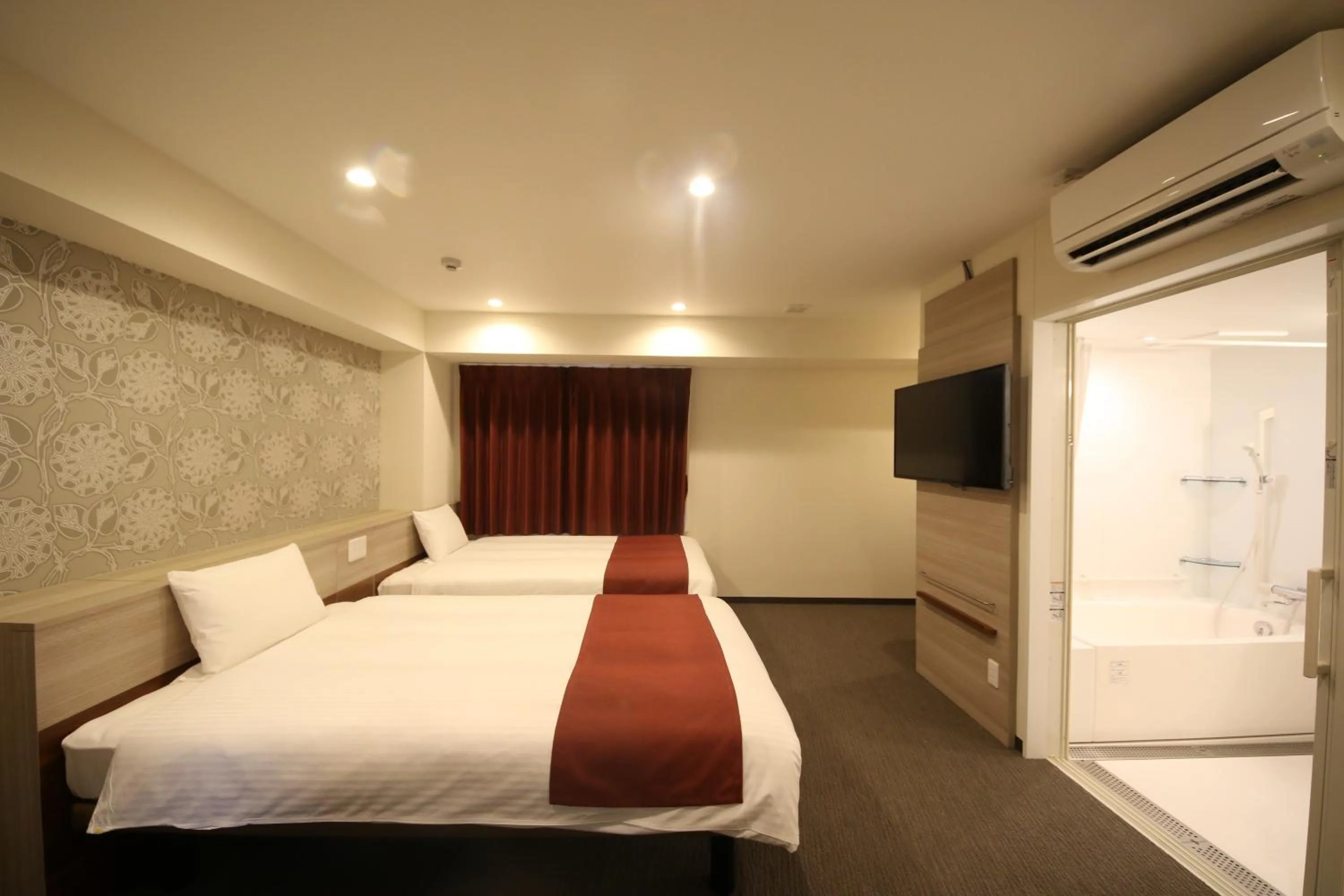 Bed in Kuretake Inn Premium Numazu Kitaguchi Ekimae