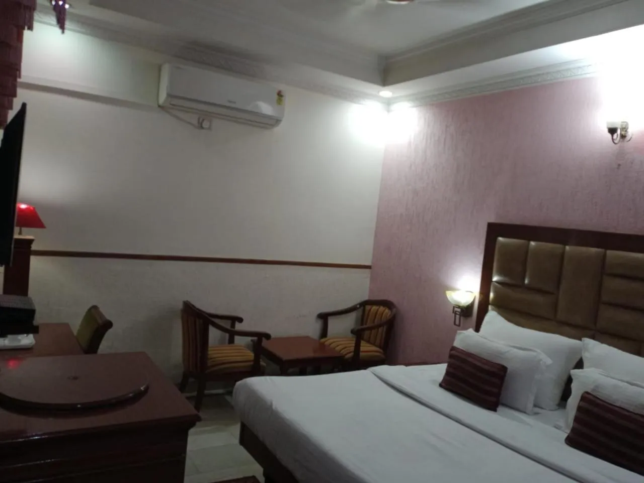 Bed in HOTEL CORPORATE INN