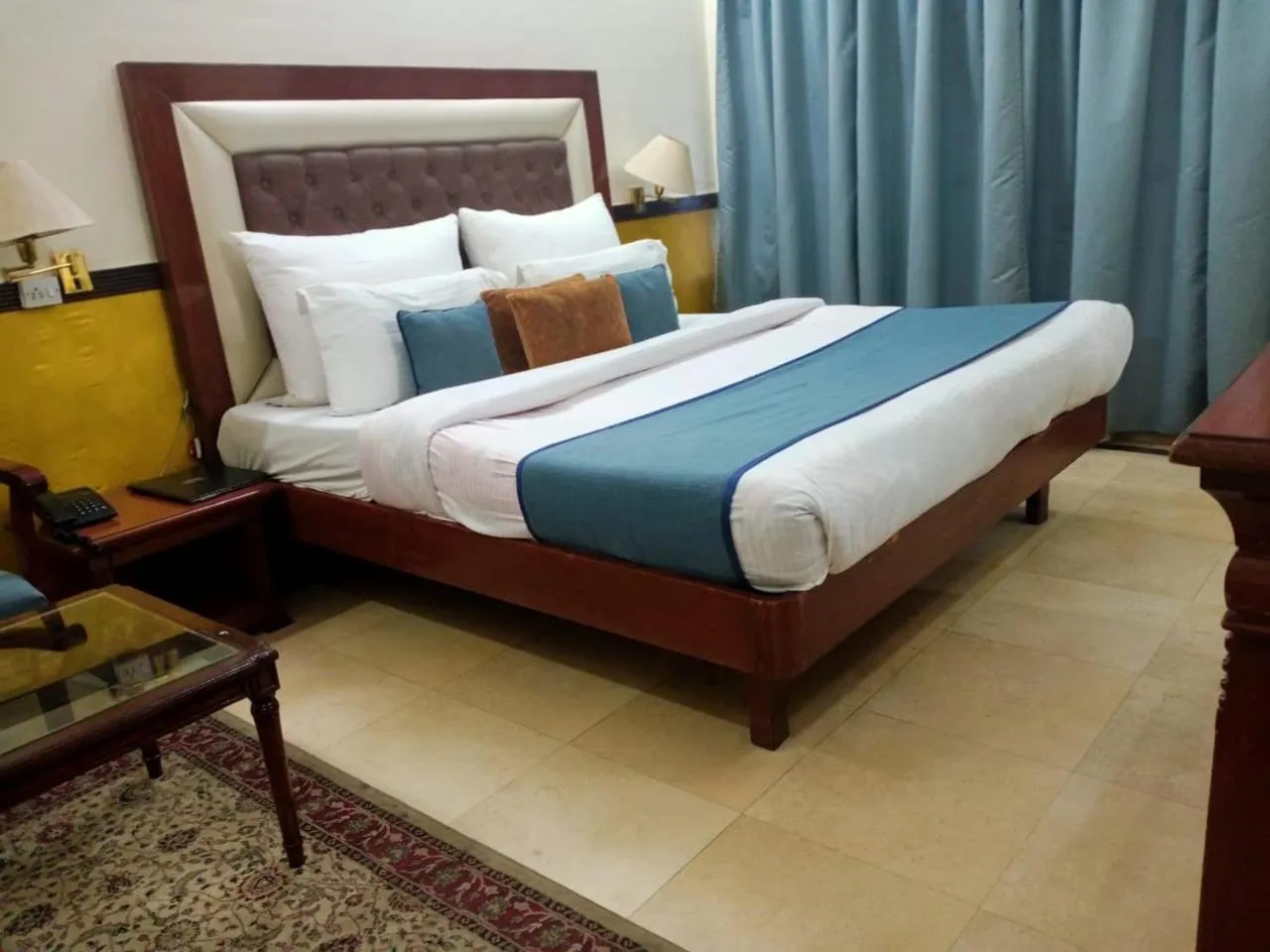 Bed in HOTEL CORPORATE INN