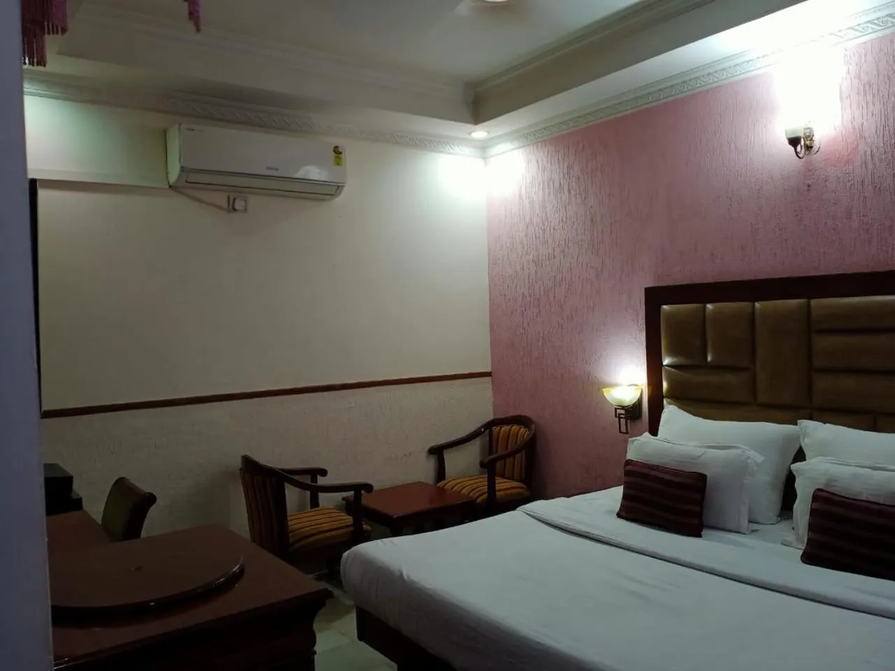 Bed in HOTEL CORPORATE INN