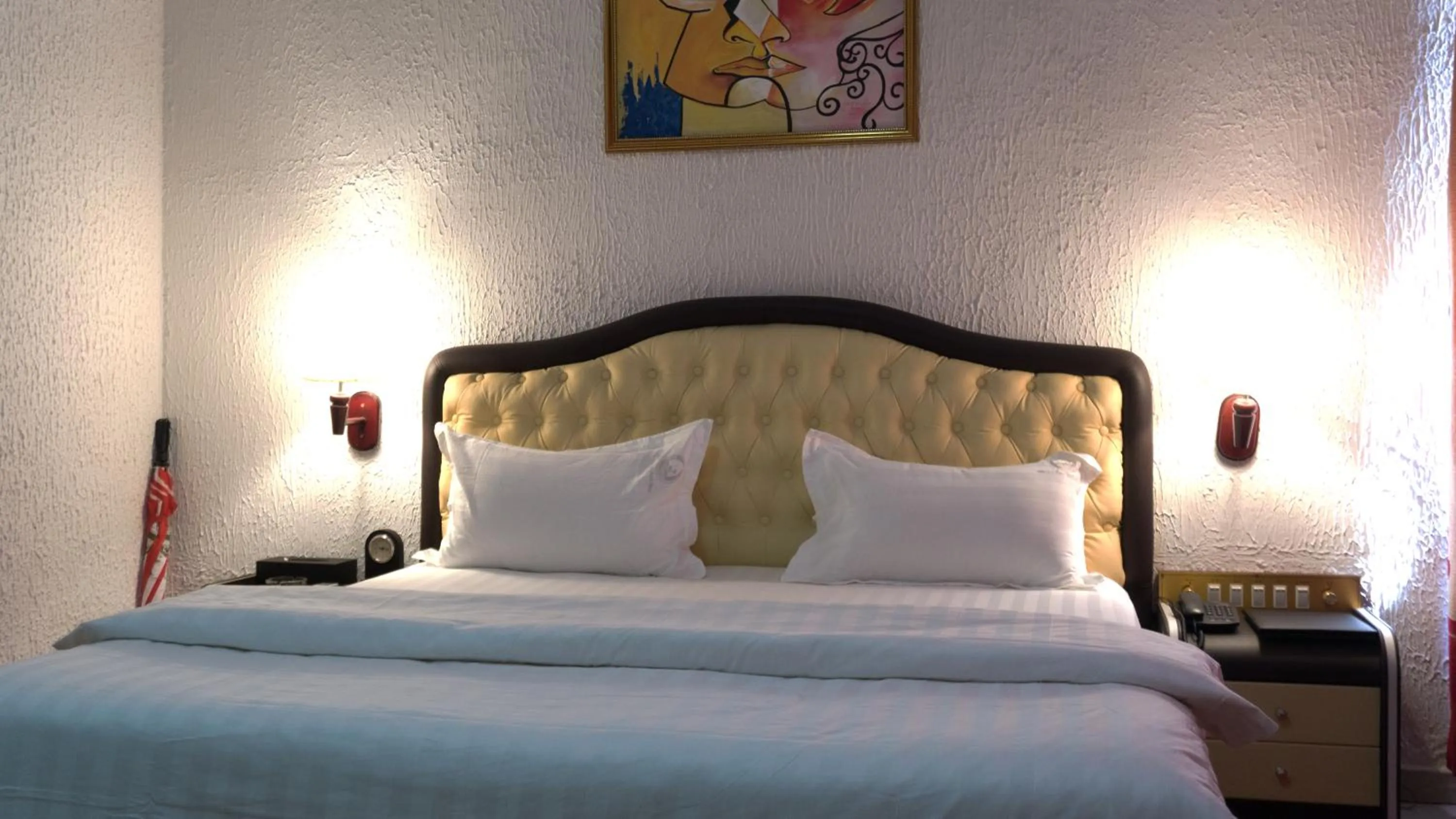 Bed in Millenium Popo Beach Hotel