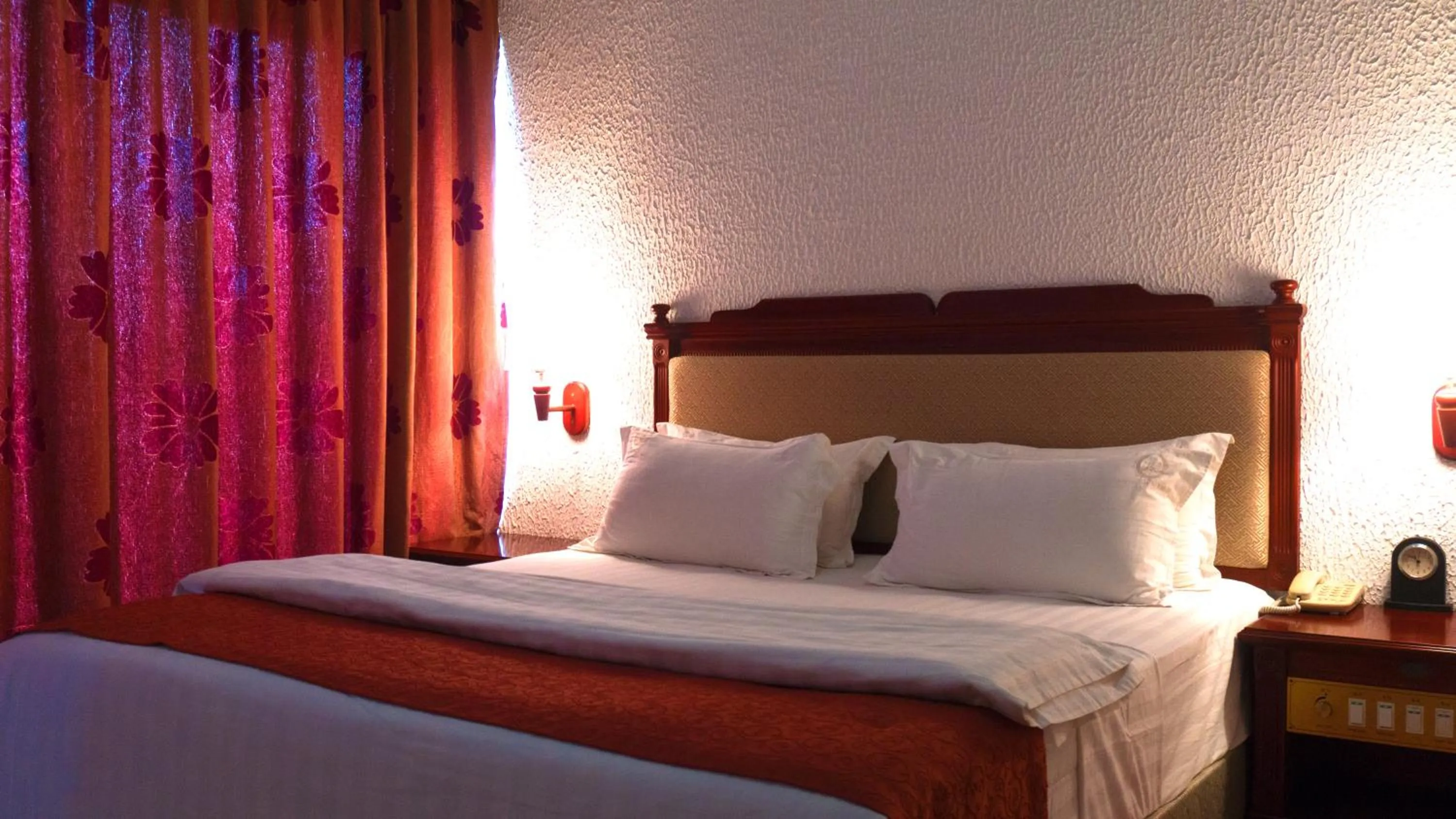 Bed in Millenium Popo Beach Hotel