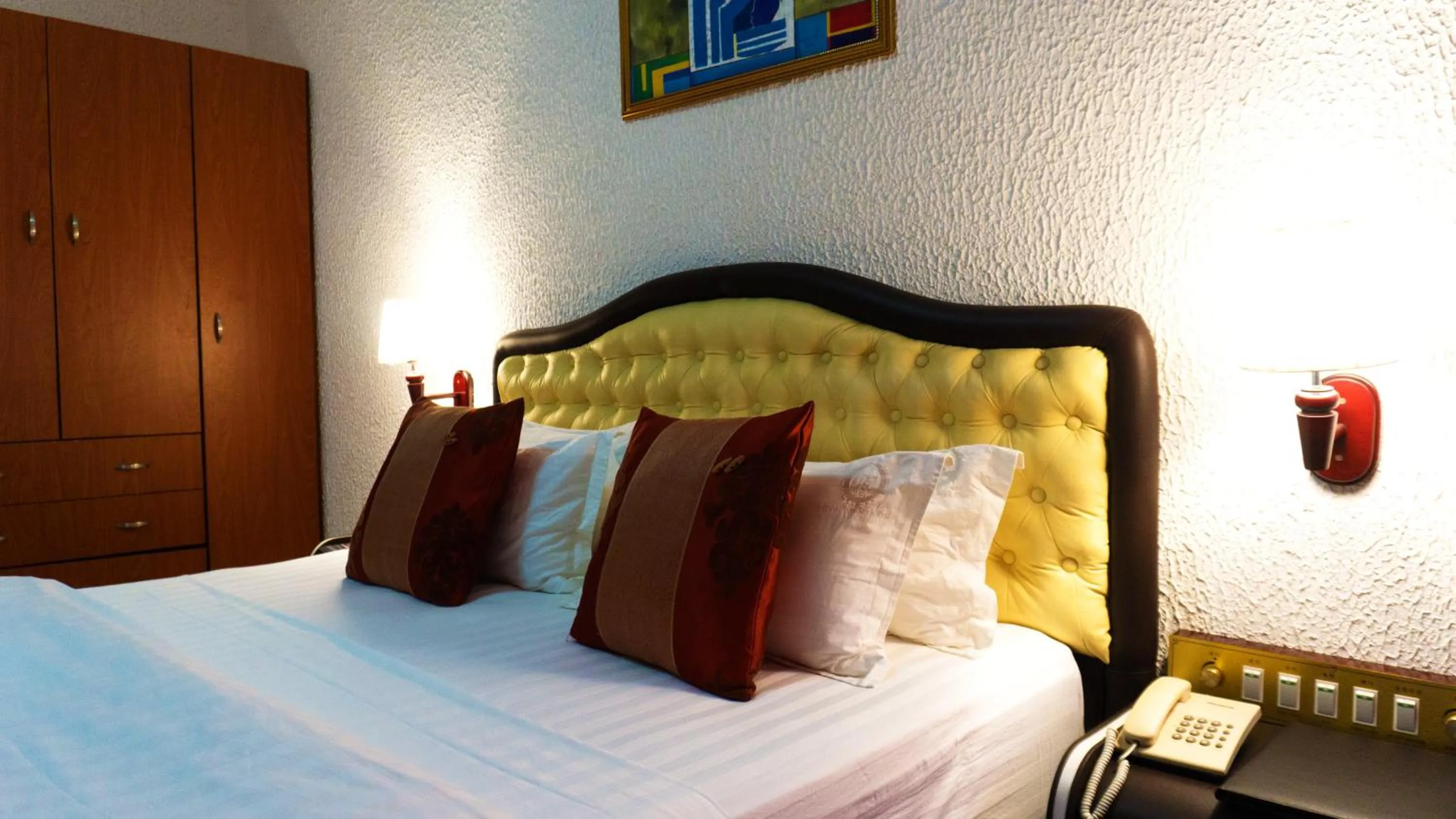 Bed in Millenium Popo Beach Hotel