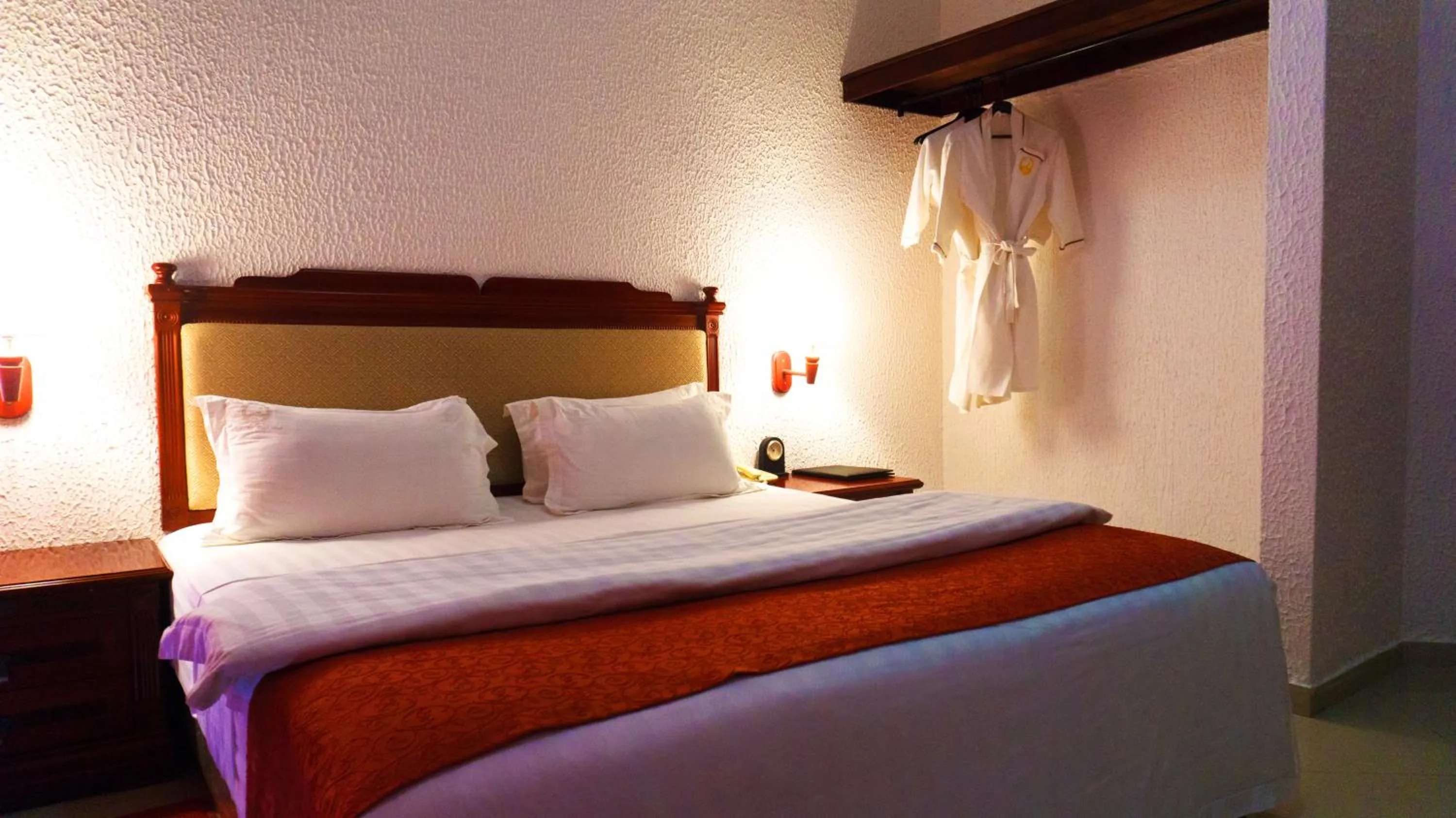 Bed in Millenium Popo Beach Hotel