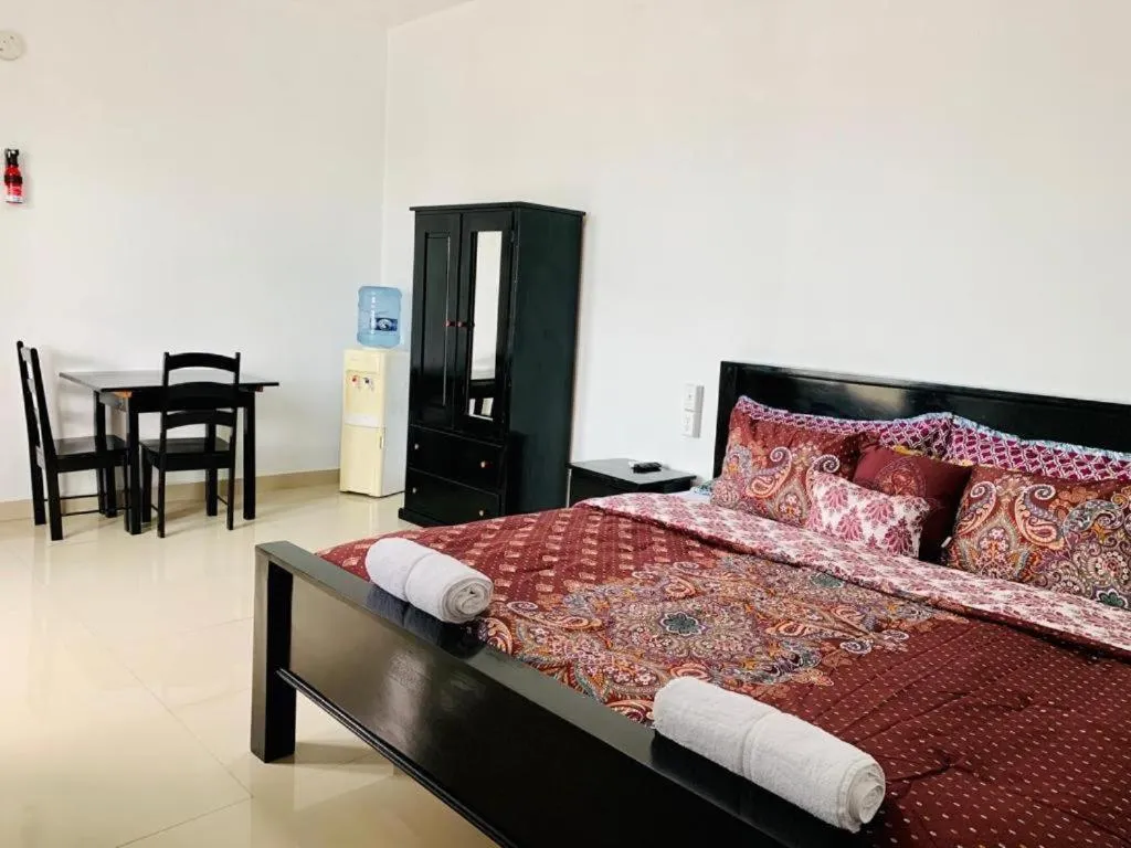 Bed in Hotel Coastalbay 2 & Golf Cart Rental