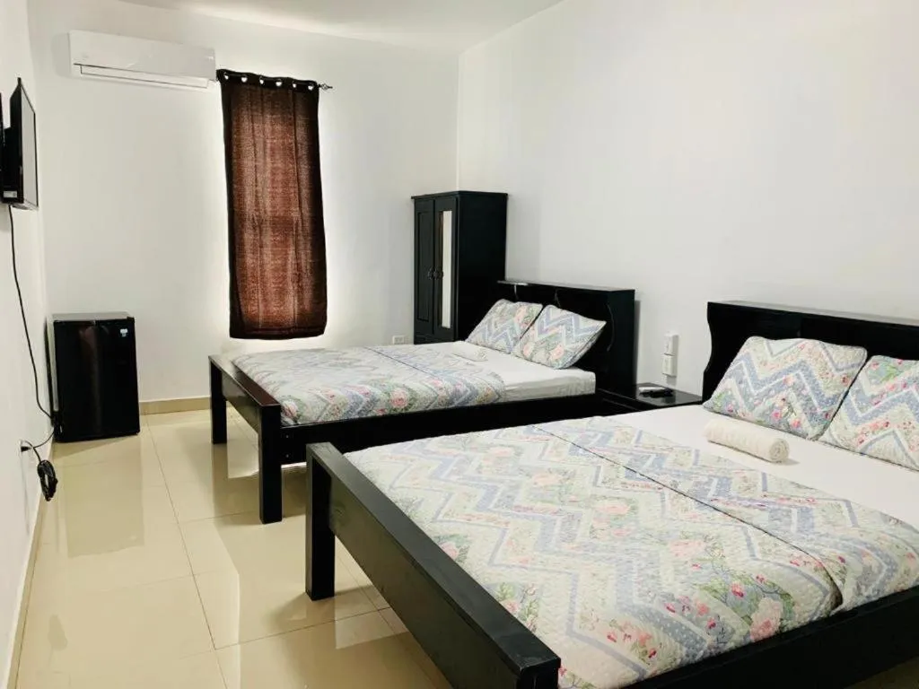 Bed in Hotel Coastalbay 2 & Golf Cart Rental