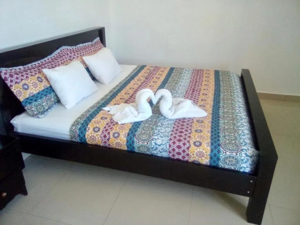 Bed in Hotel Coastalbay 2 & Golf Cart Rental