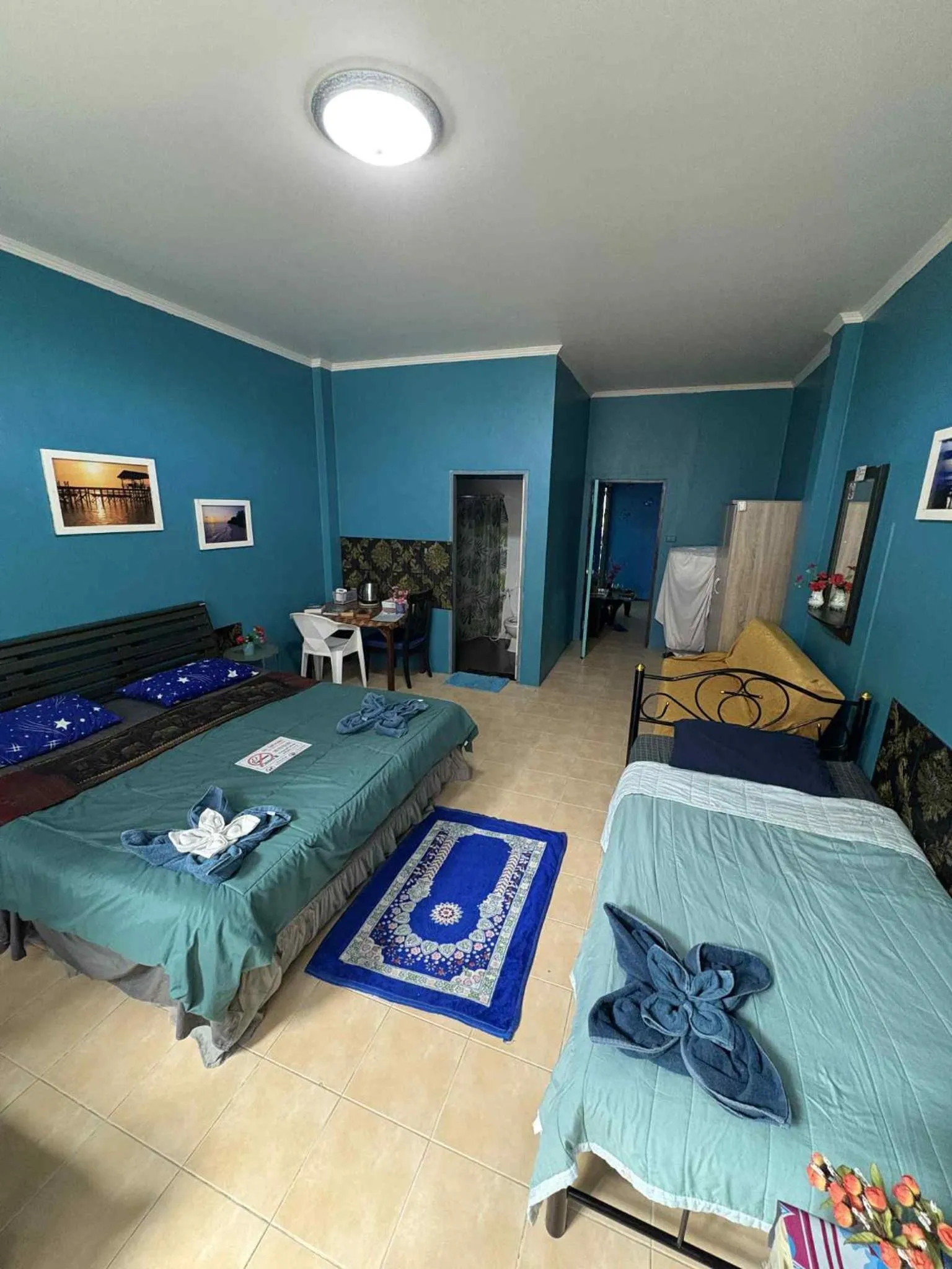 Bed in San Antonio Beach Guesthouse & Restaurant