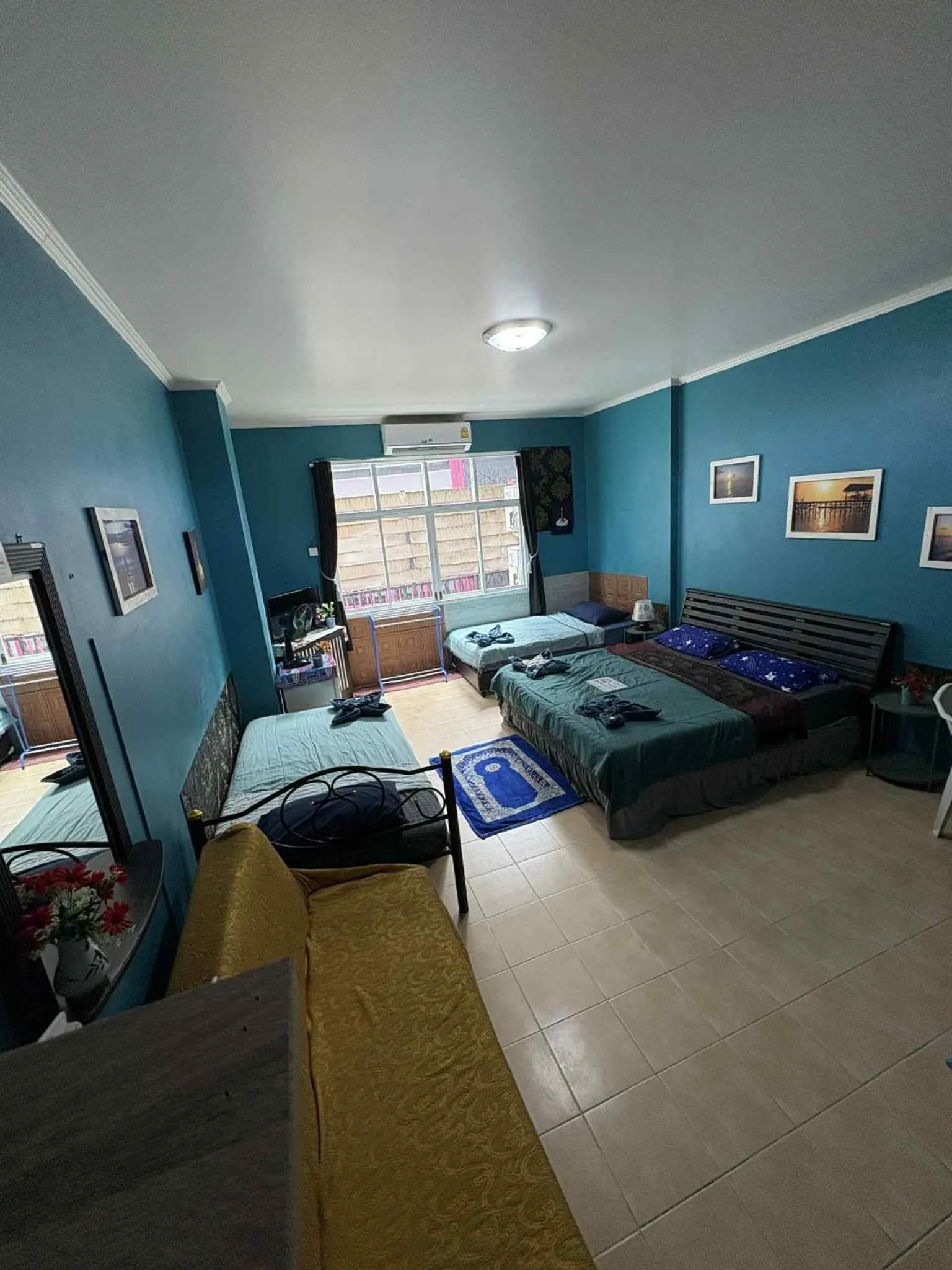 Bed in San Antonio Beach Guesthouse & Restaurant