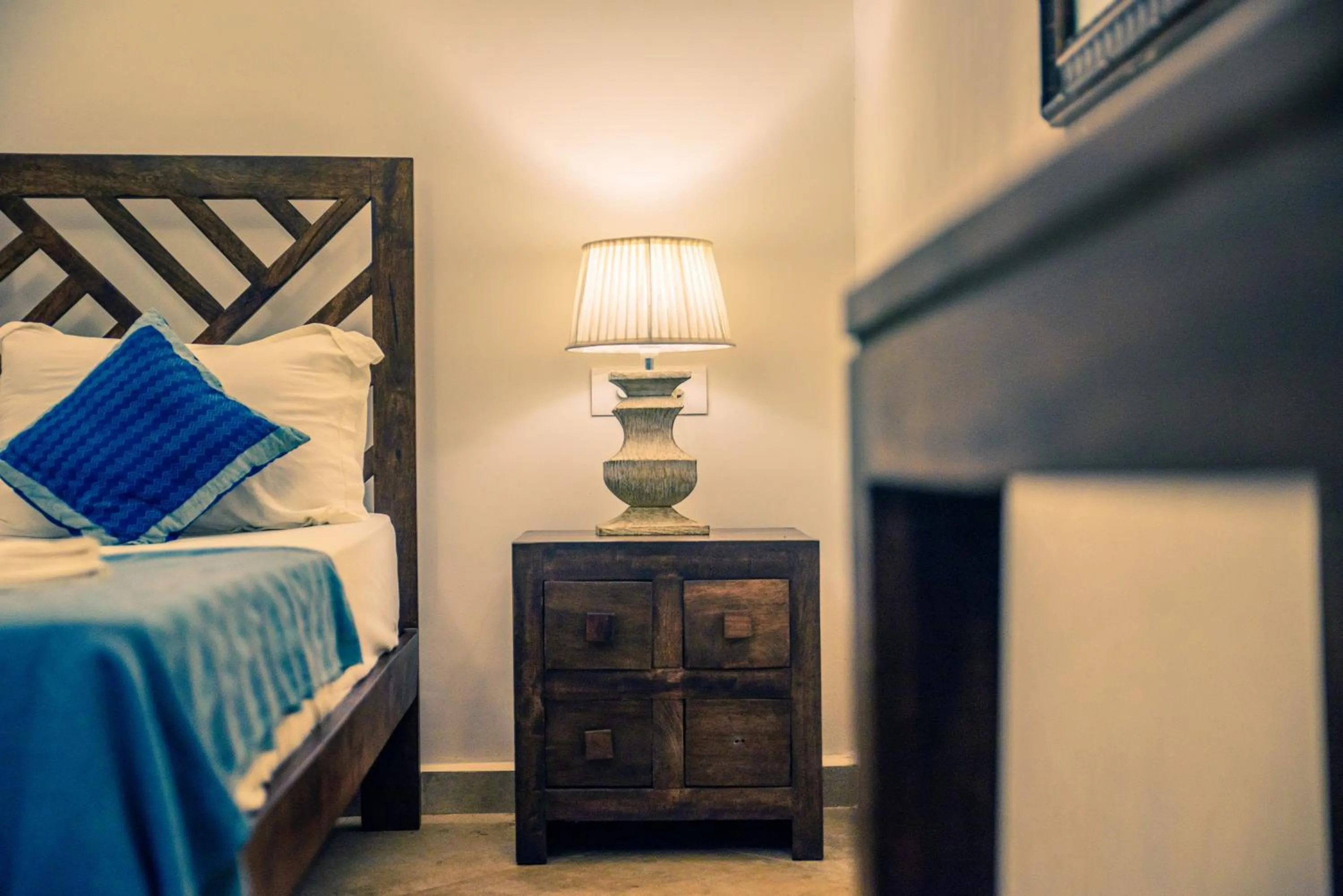 Decorative detail, Bed in Little India Beach Cottages