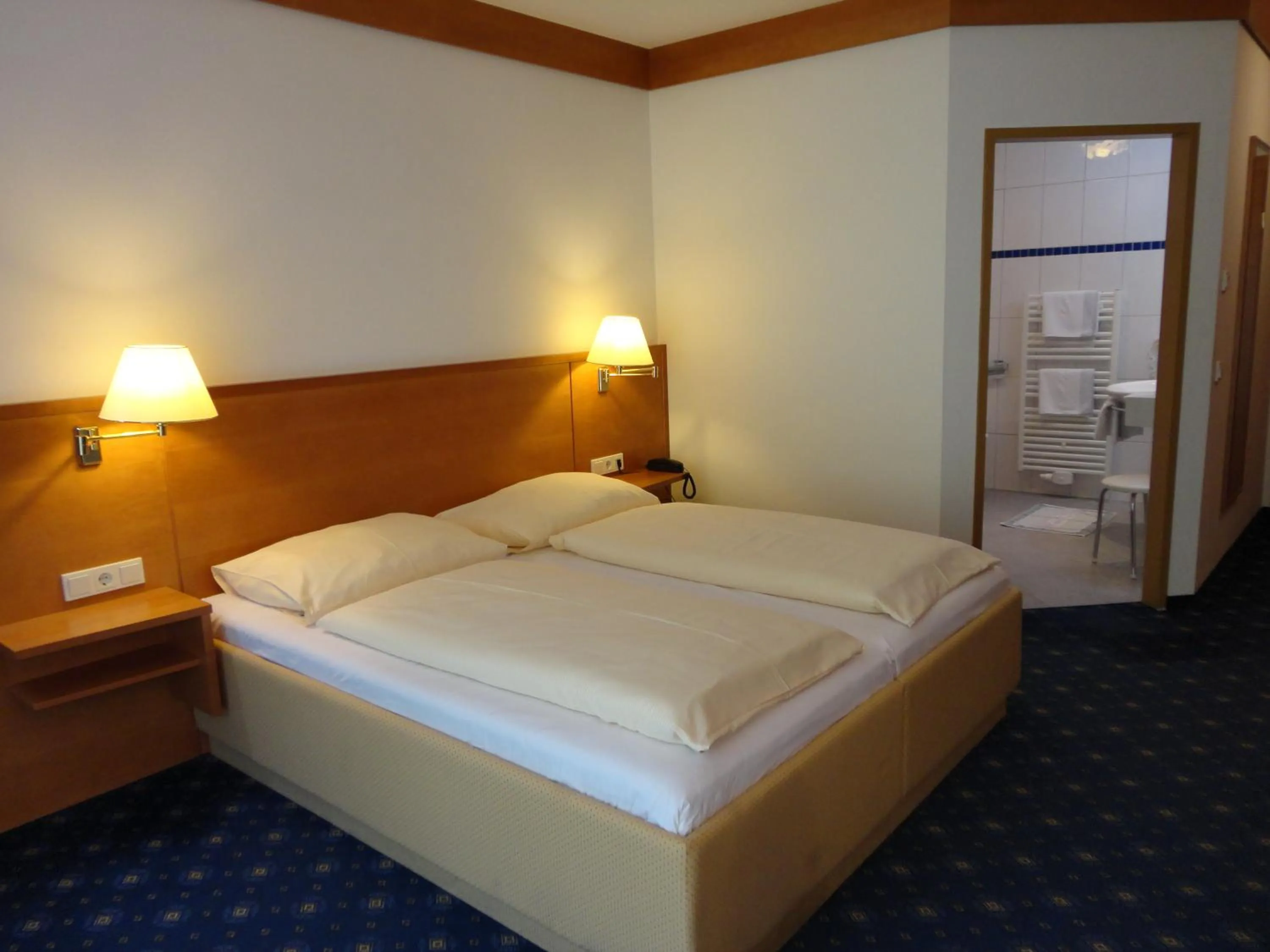 Bedroom, Bed in Business-Hotel Stockinger