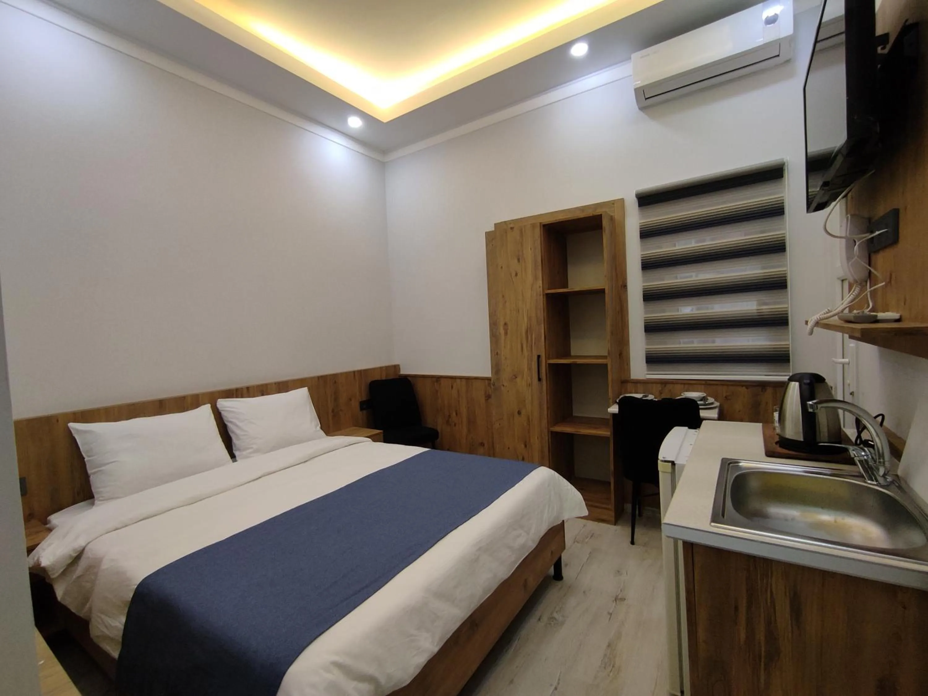 Kitchen or kitchenette, Bed in Life Span Hotels