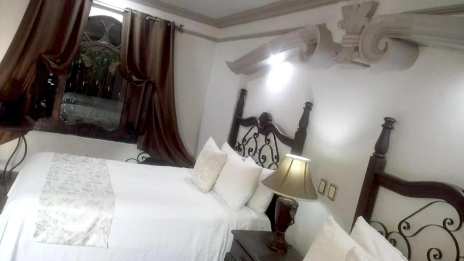 Bed in Hotel Hacienda los Narcisos