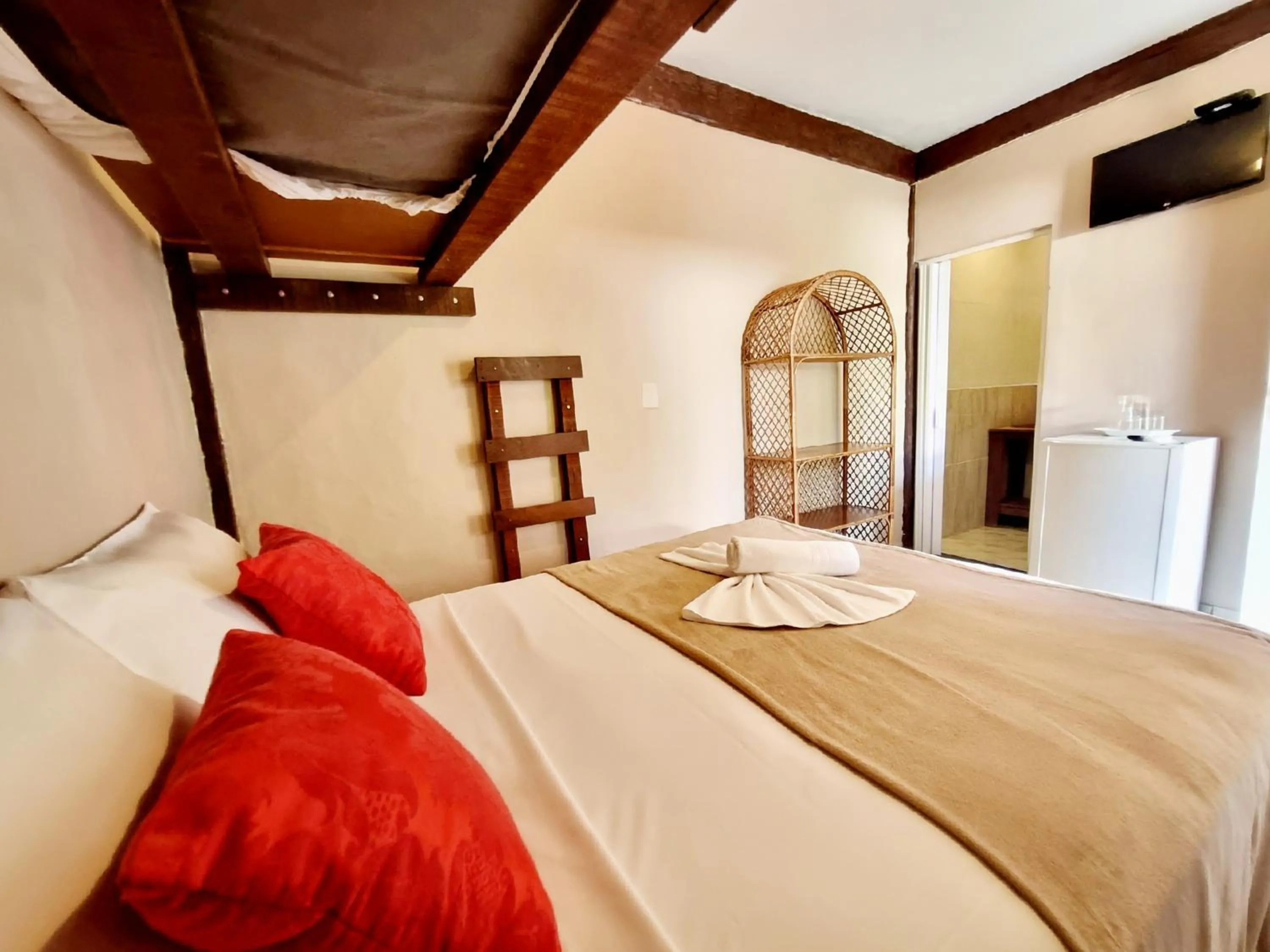 Bed in Pousada Delta Mar Maresias