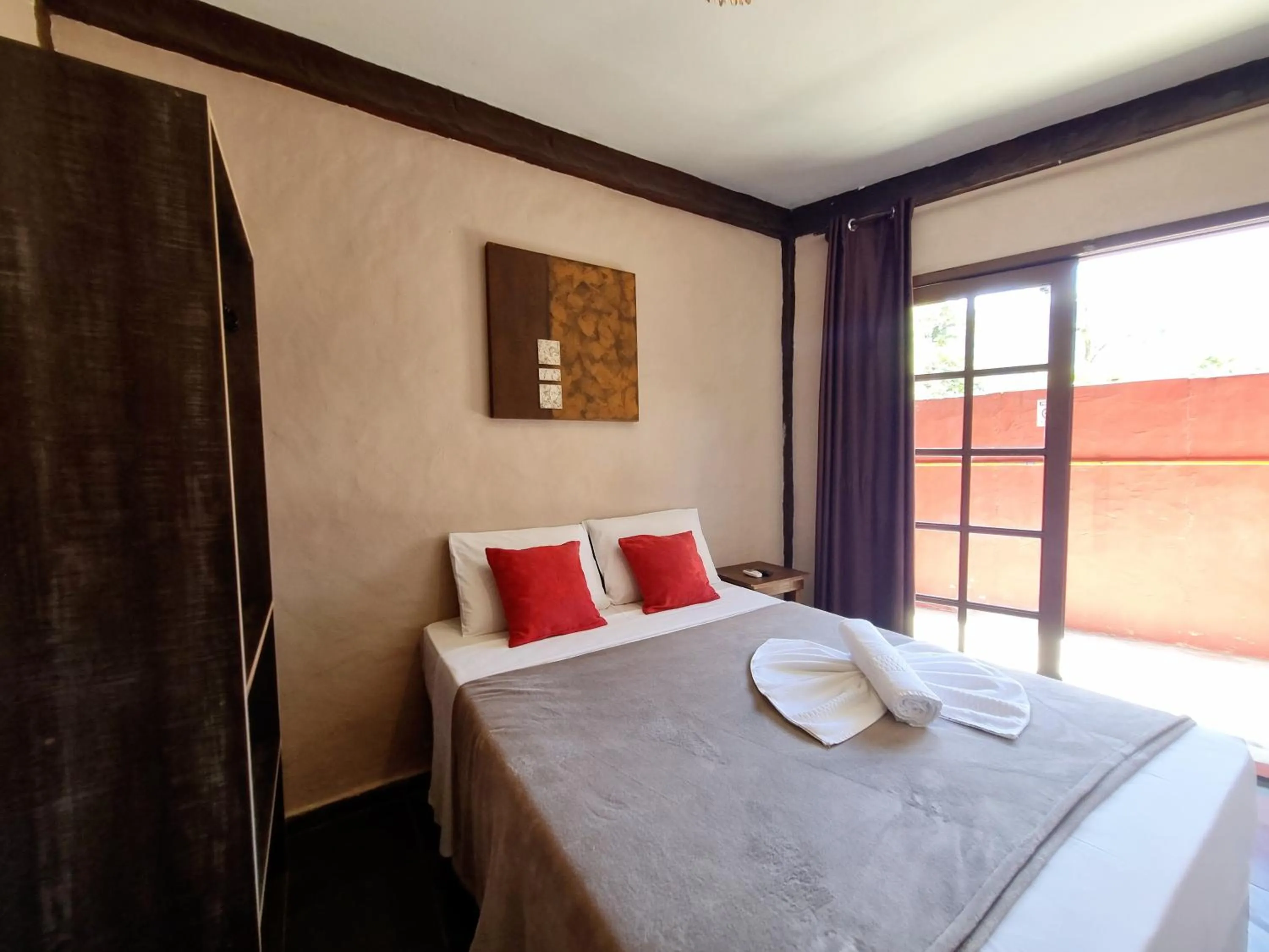 Bed in Pousada Delta Mar Maresias