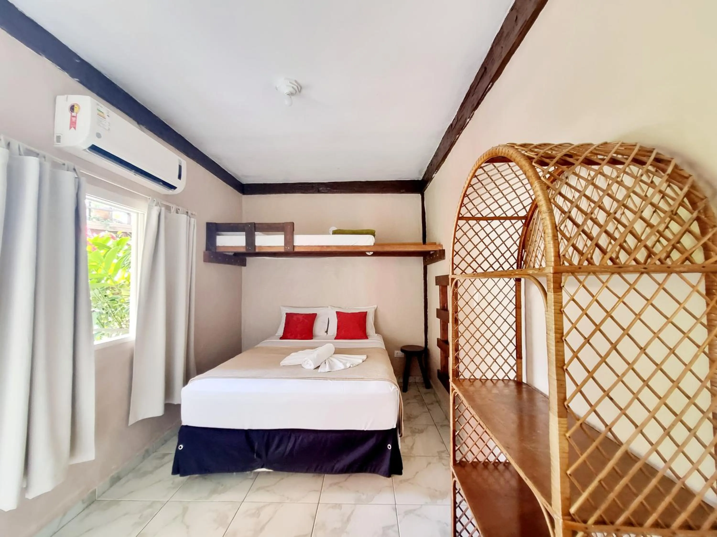 Bed in Pousada Delta Mar Maresias