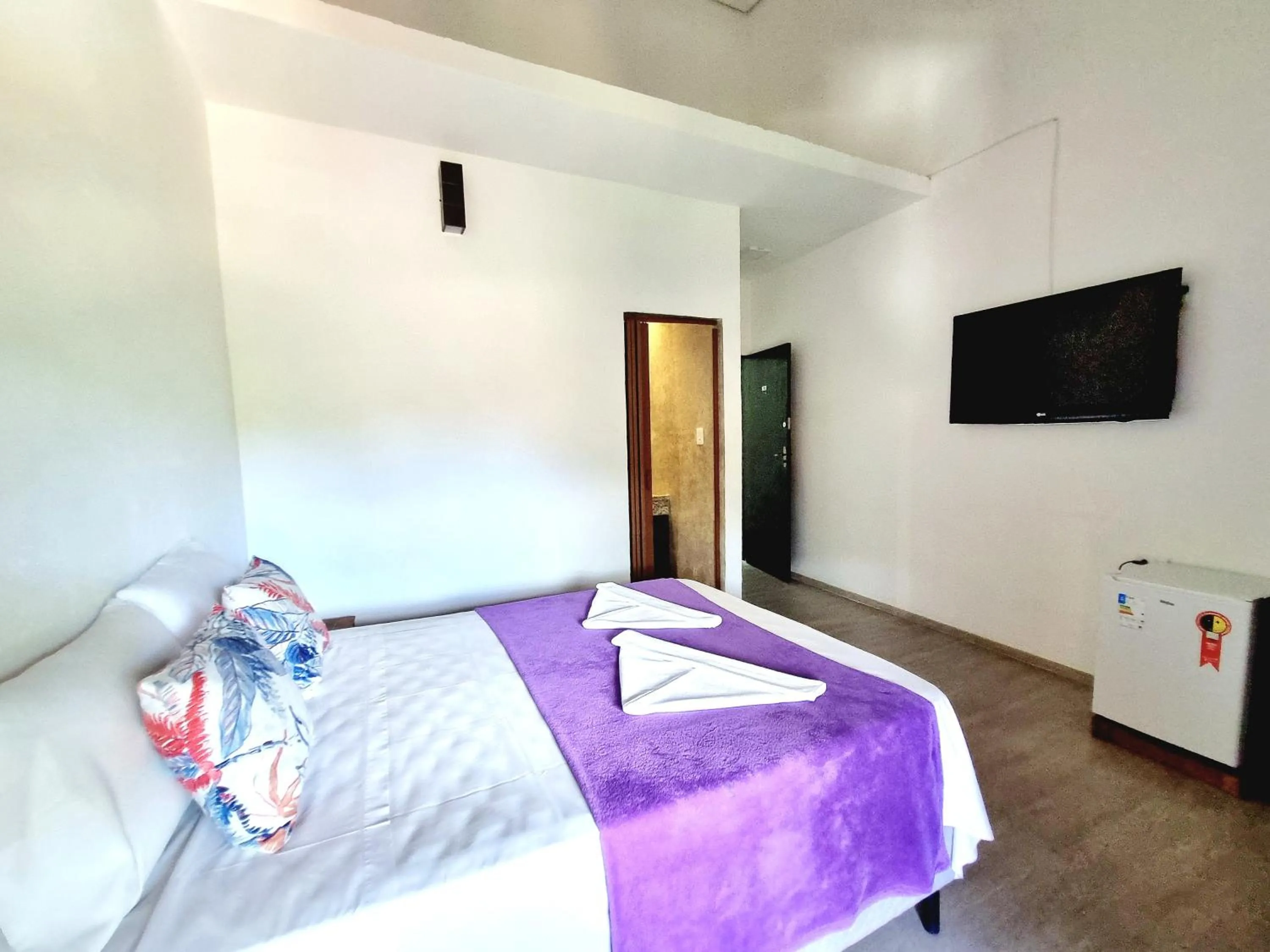 Bed in Pousada Delta Mar Maresias