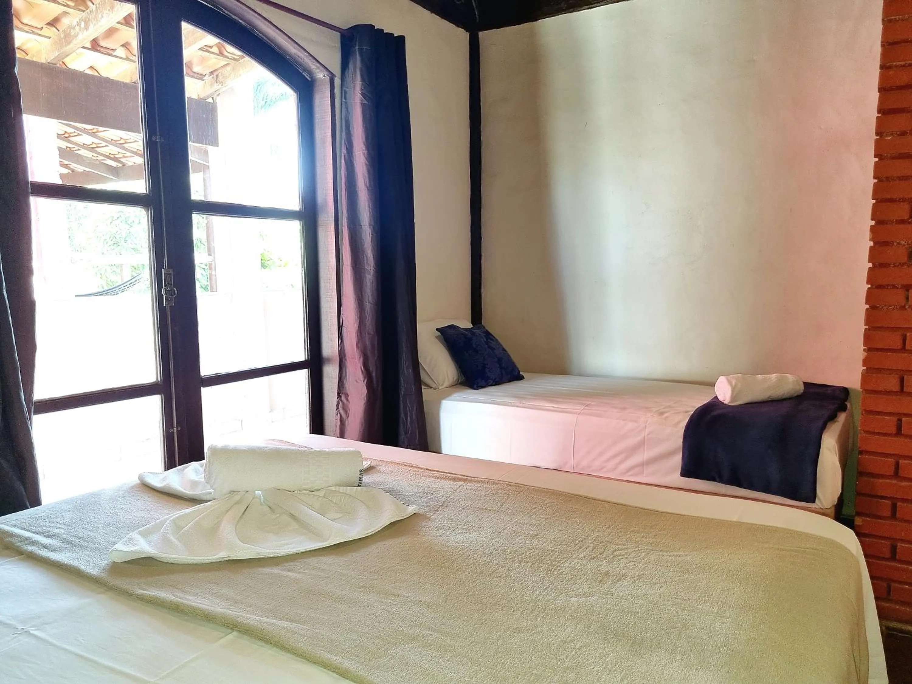 Bed in Pousada Delta Mar Maresias