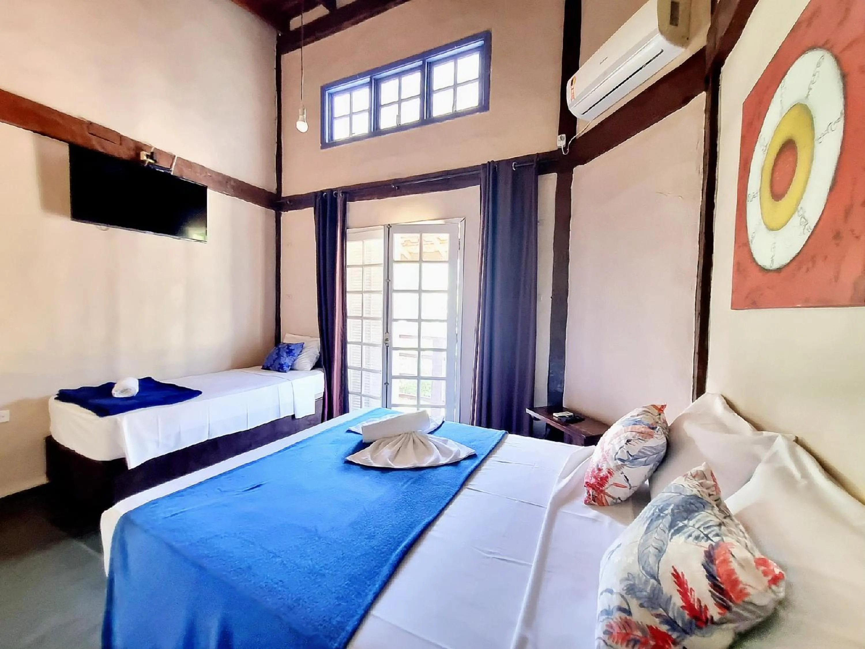 Bed in Pousada Delta Mar Maresias