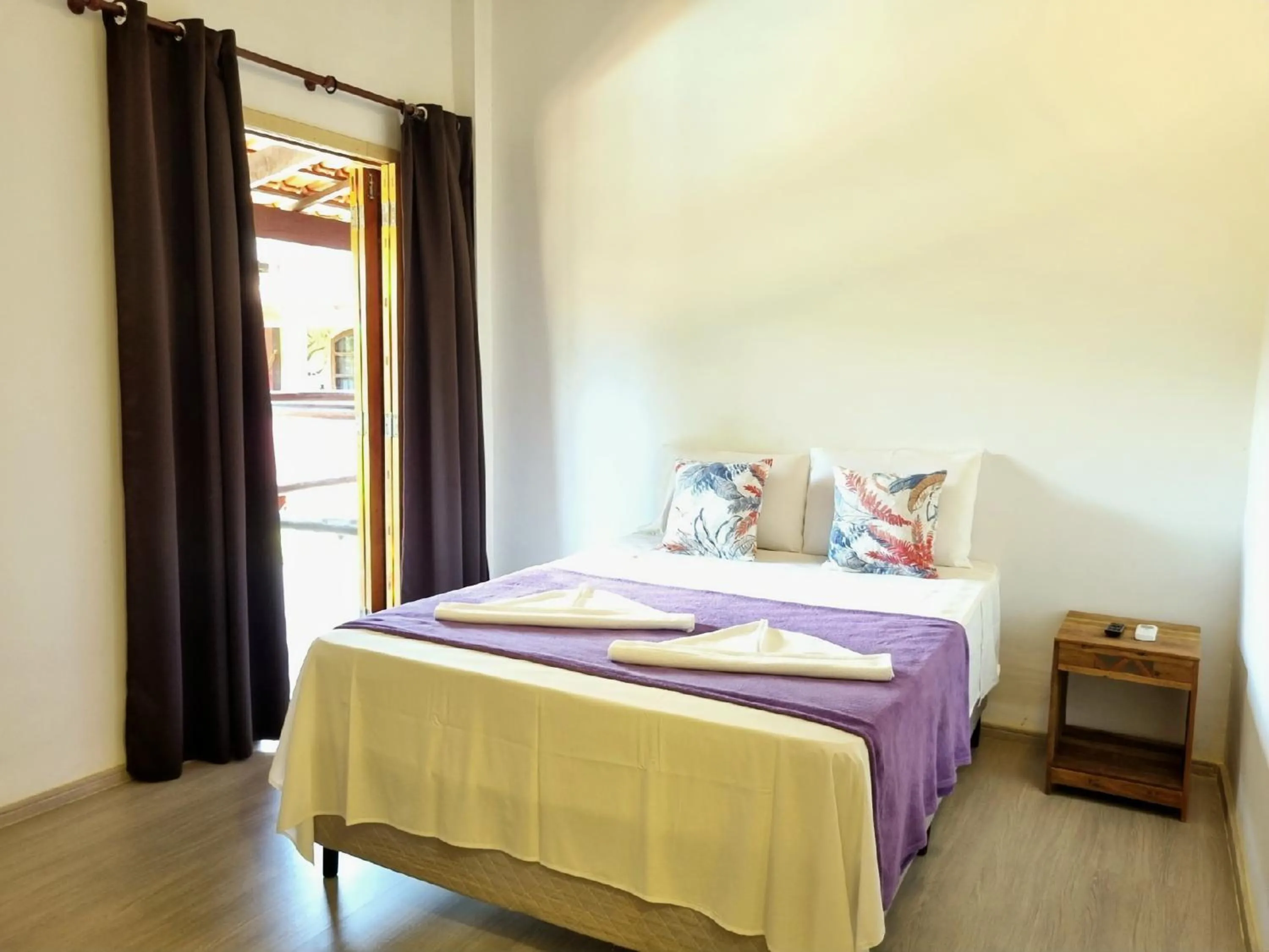 Bed in Pousada Delta Mar Maresias