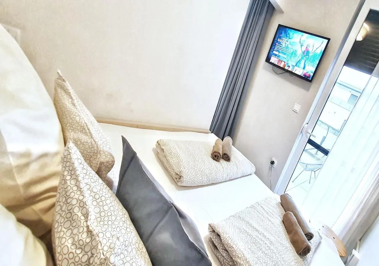 TV and multimedia, Bed in Marina Apartment by Dora