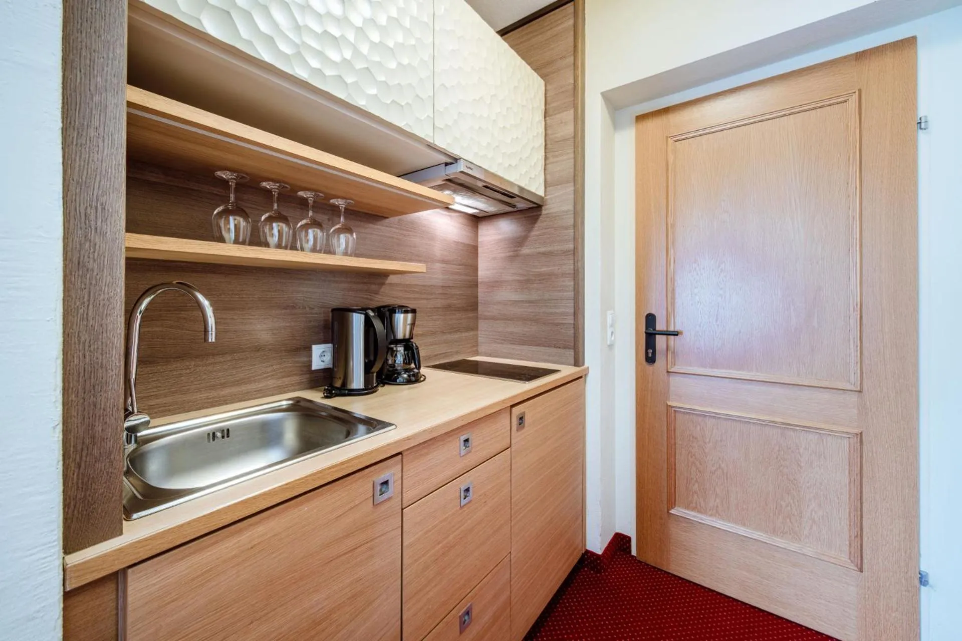 Kitchen or kitchenette in Harmls Aparthotel