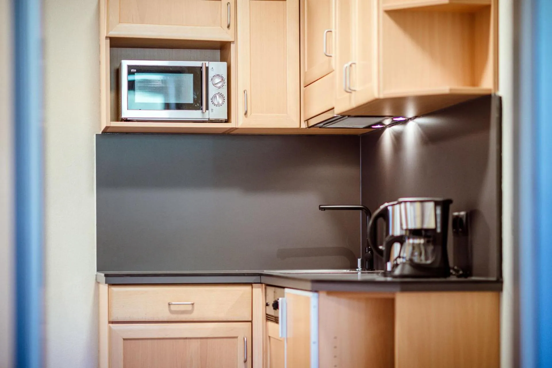 Kitchen or kitchenette in Harmls Aparthotel