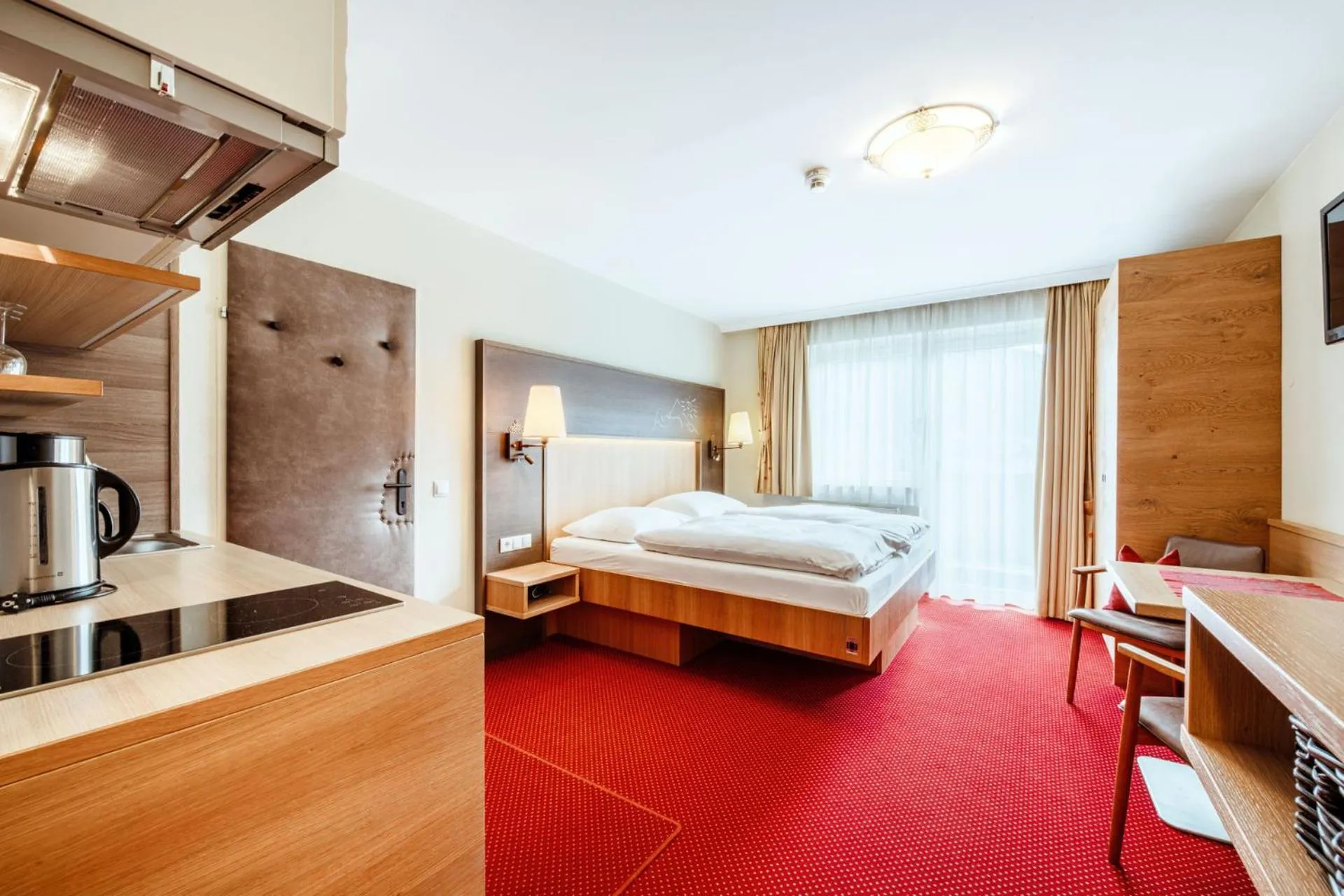 Kitchen or kitchenette, Bed in Harmls Aparthotel