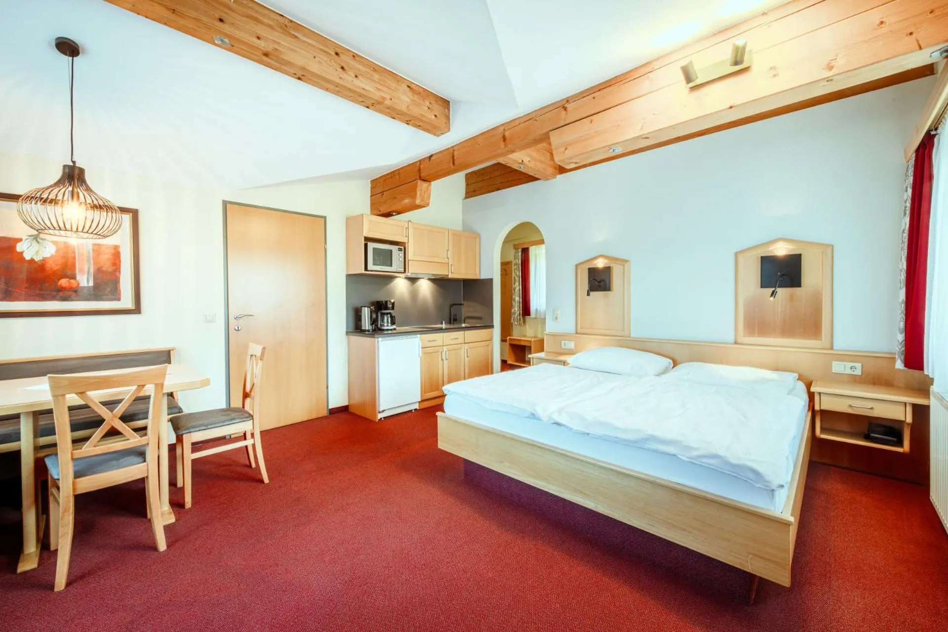 Kitchen or kitchenette, Bed in Harmls Aparthotel