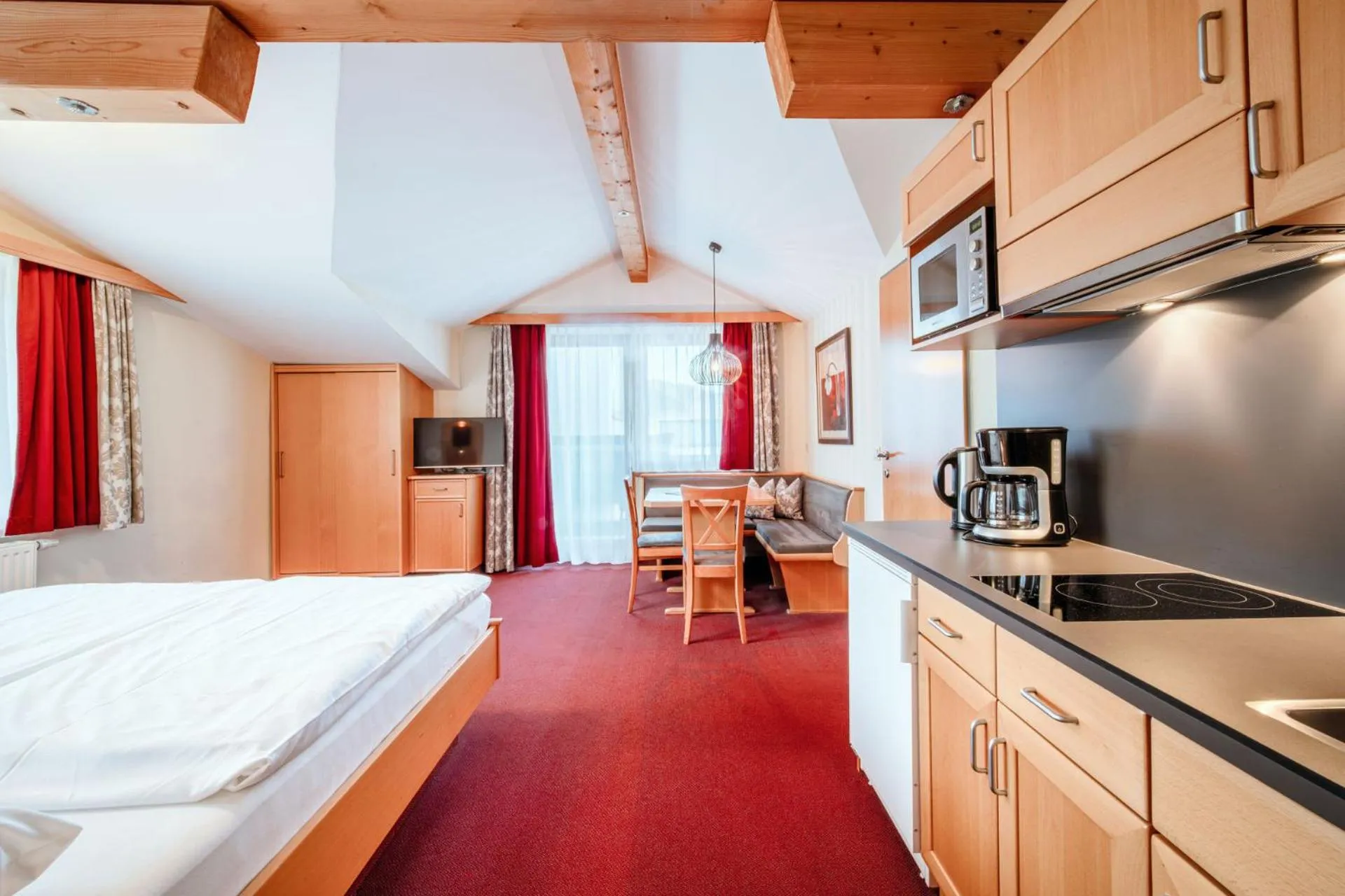 Kitchen or kitchenette, Bed in Harmls Aparthotel