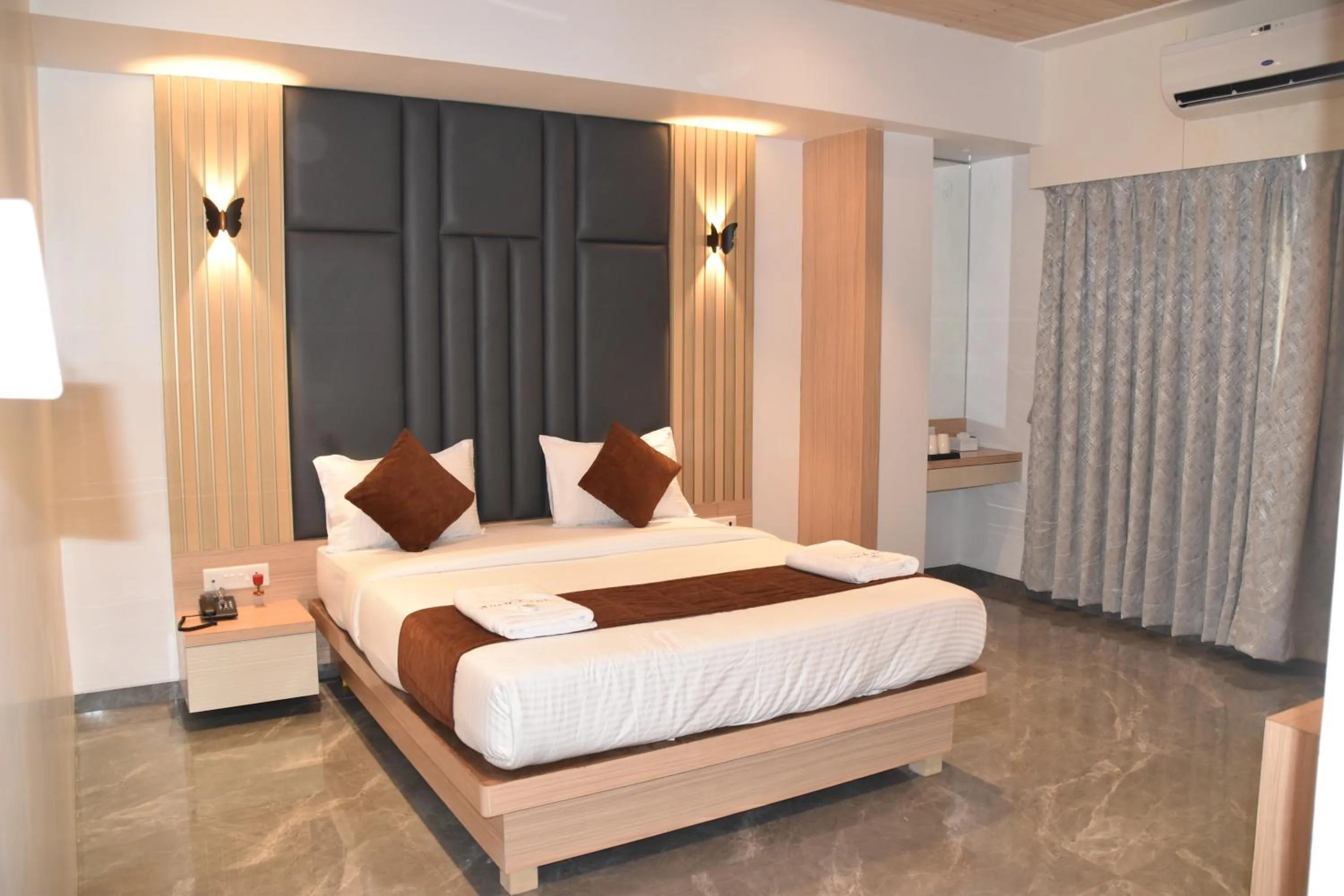 Bed in Hotel Aarush Inn