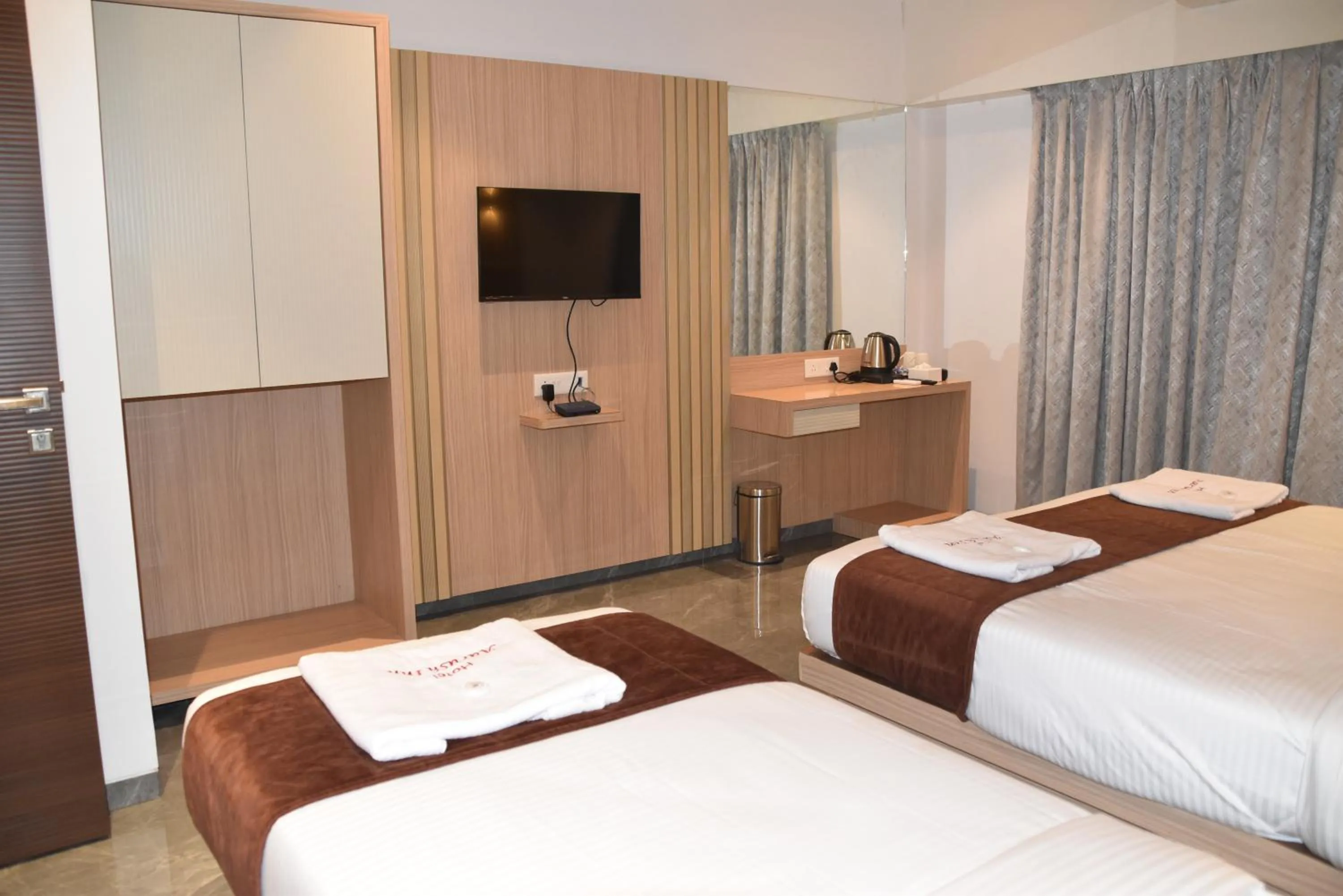 Bed in Hotel Aarush Inn