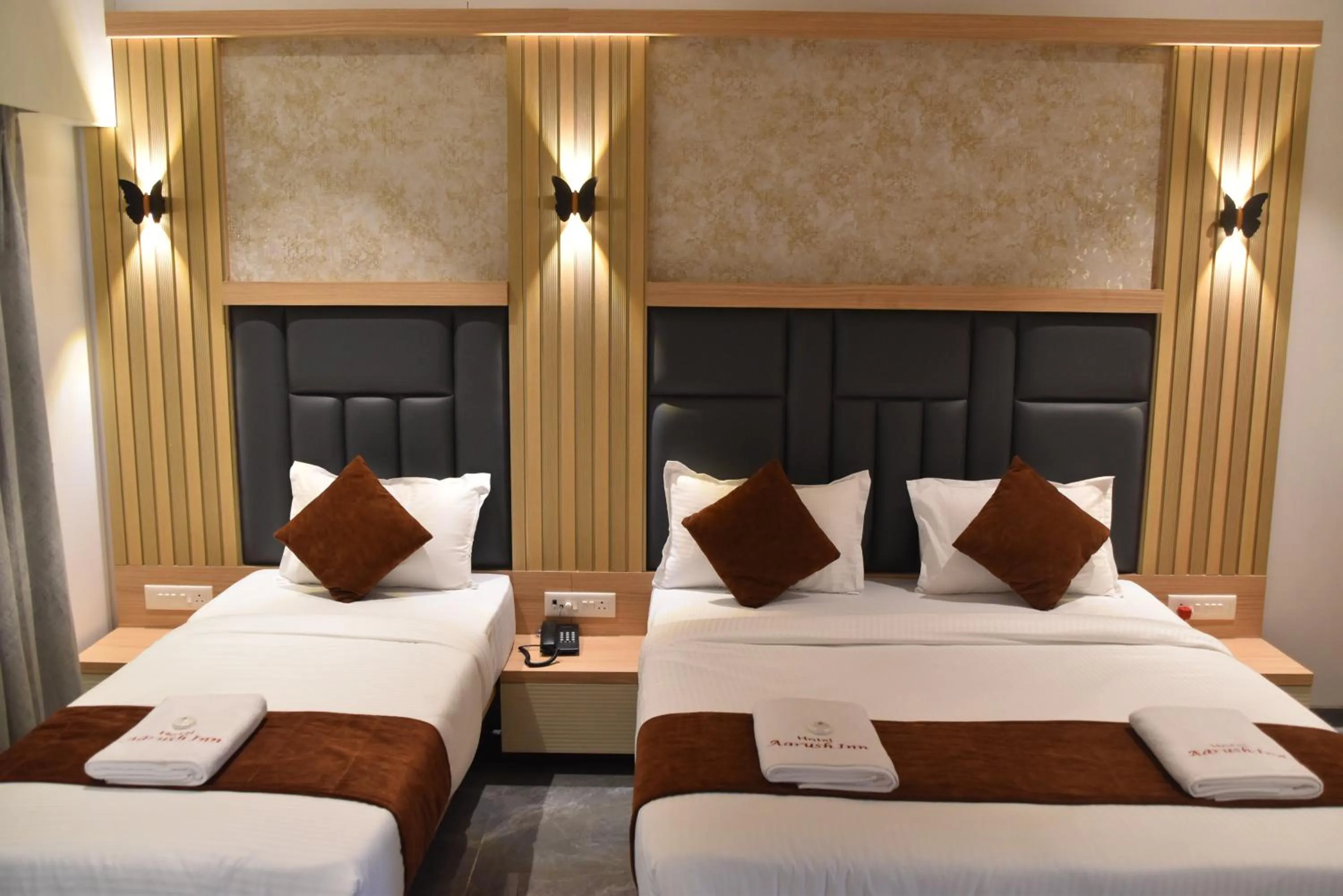 Bed in Hotel Aarush Inn