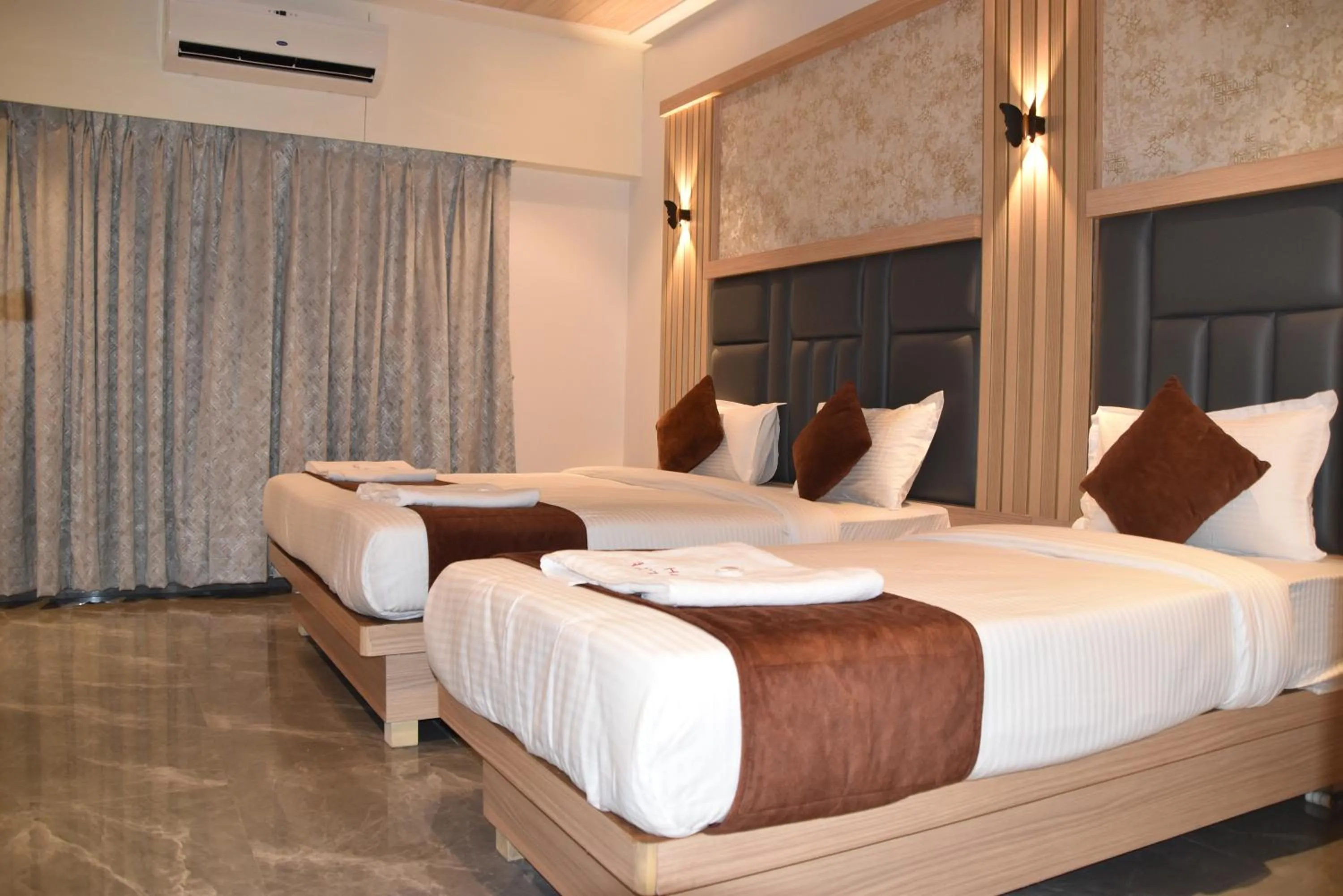 Bed in Hotel Aarush Inn