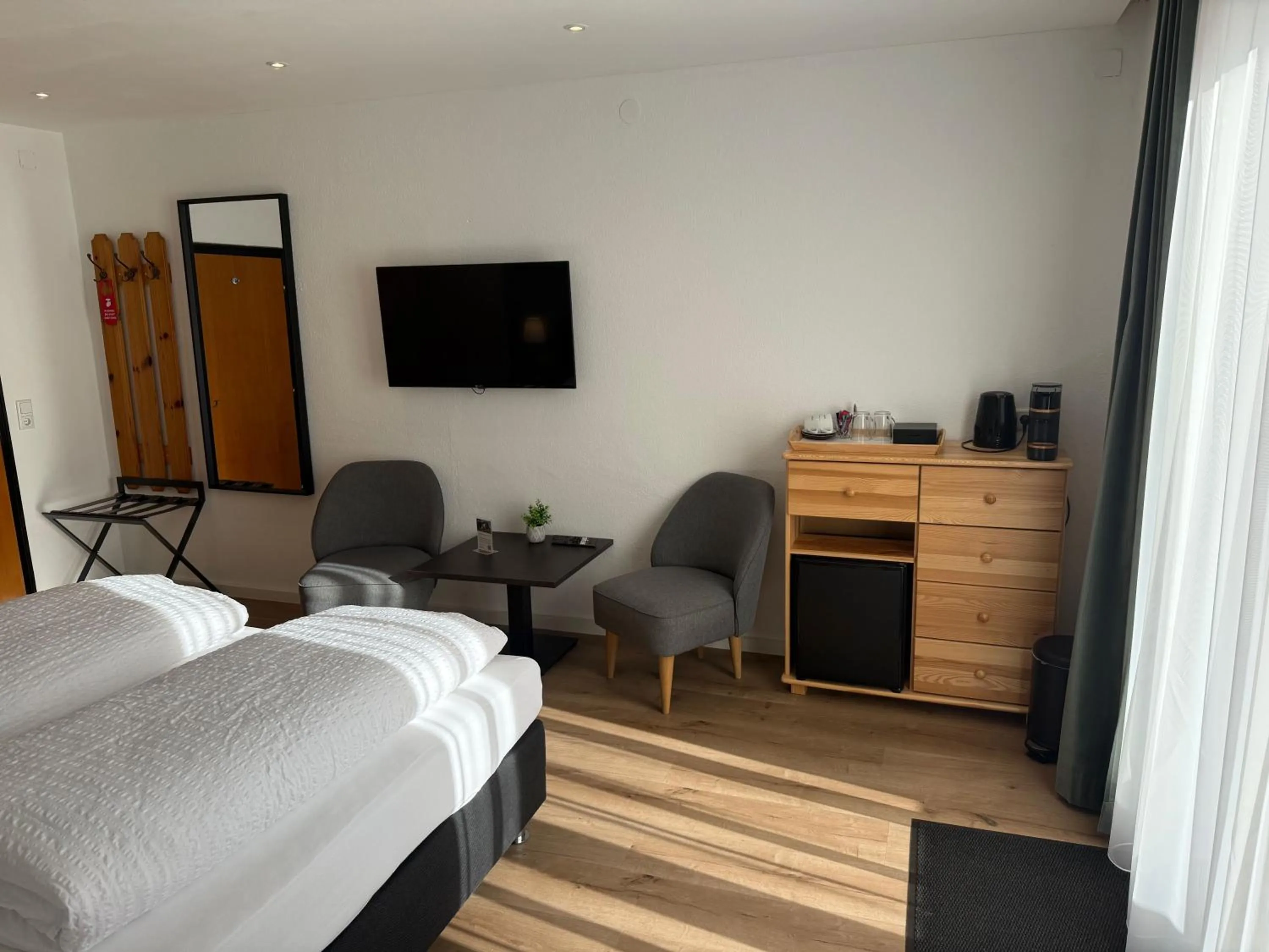 Seating area, Bed in Hotel Berghof