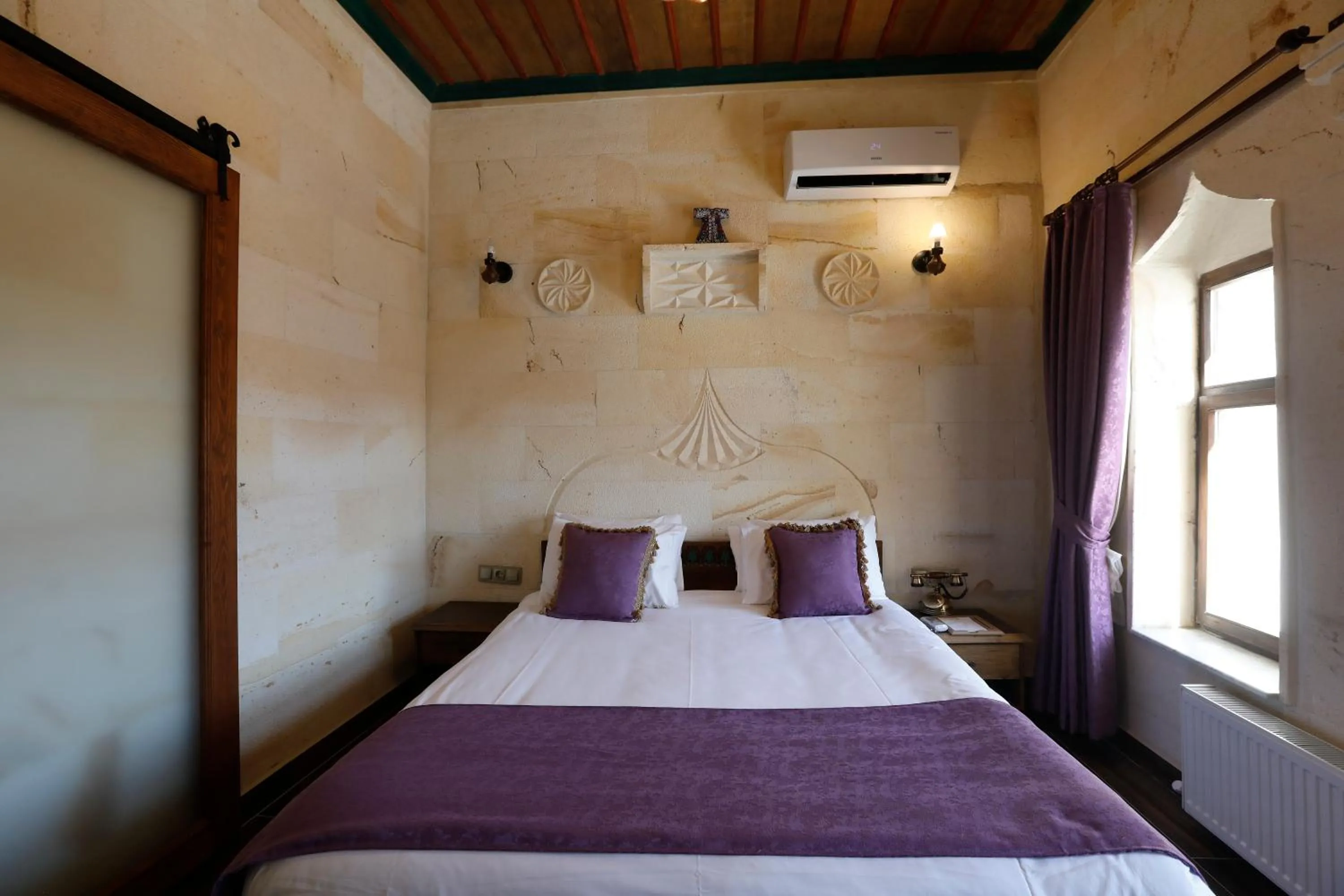 Bed in Ada Cave Suites