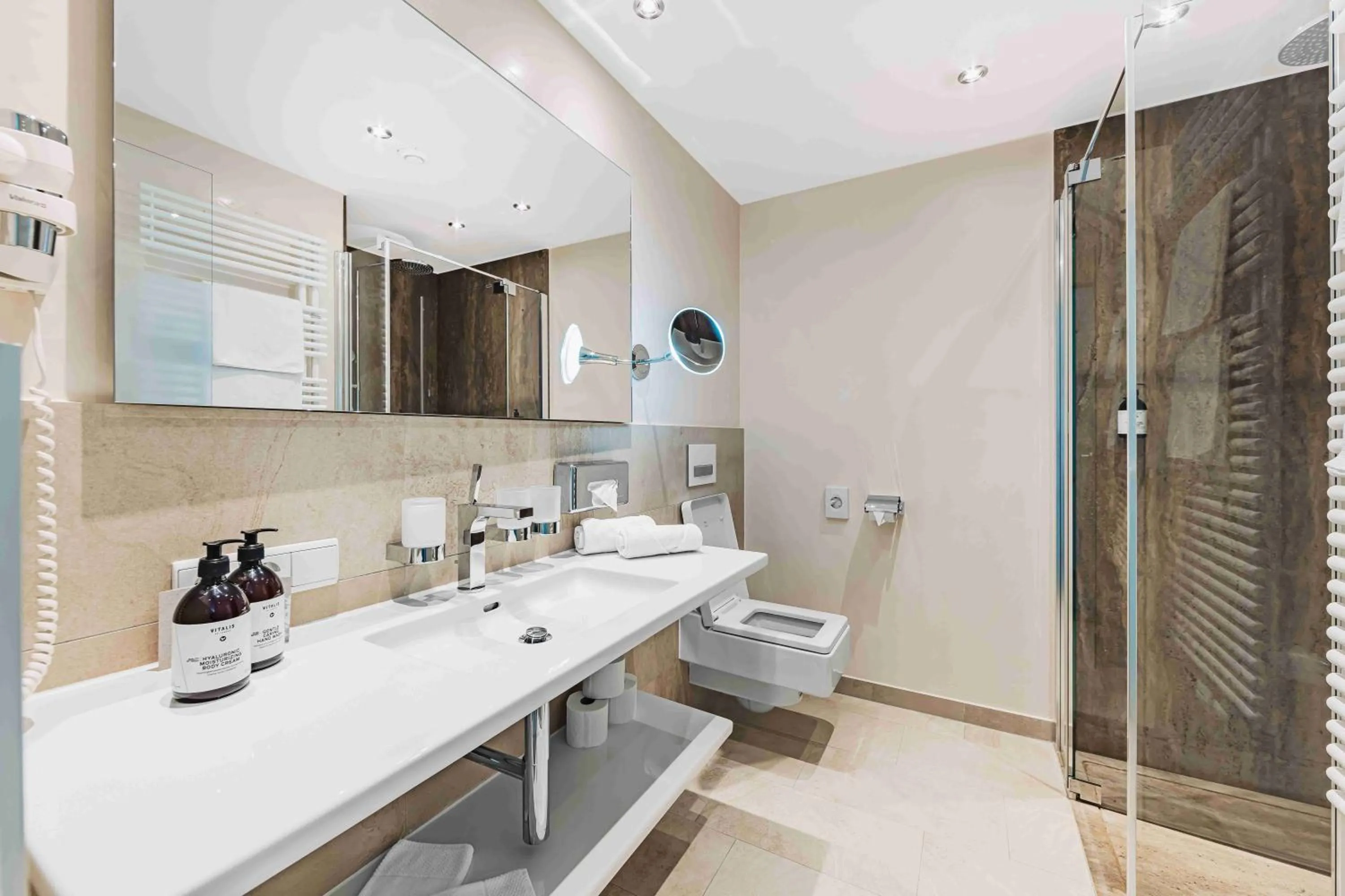 Bathroom in SKI - GOLF - WELLNESS Hotel Riml