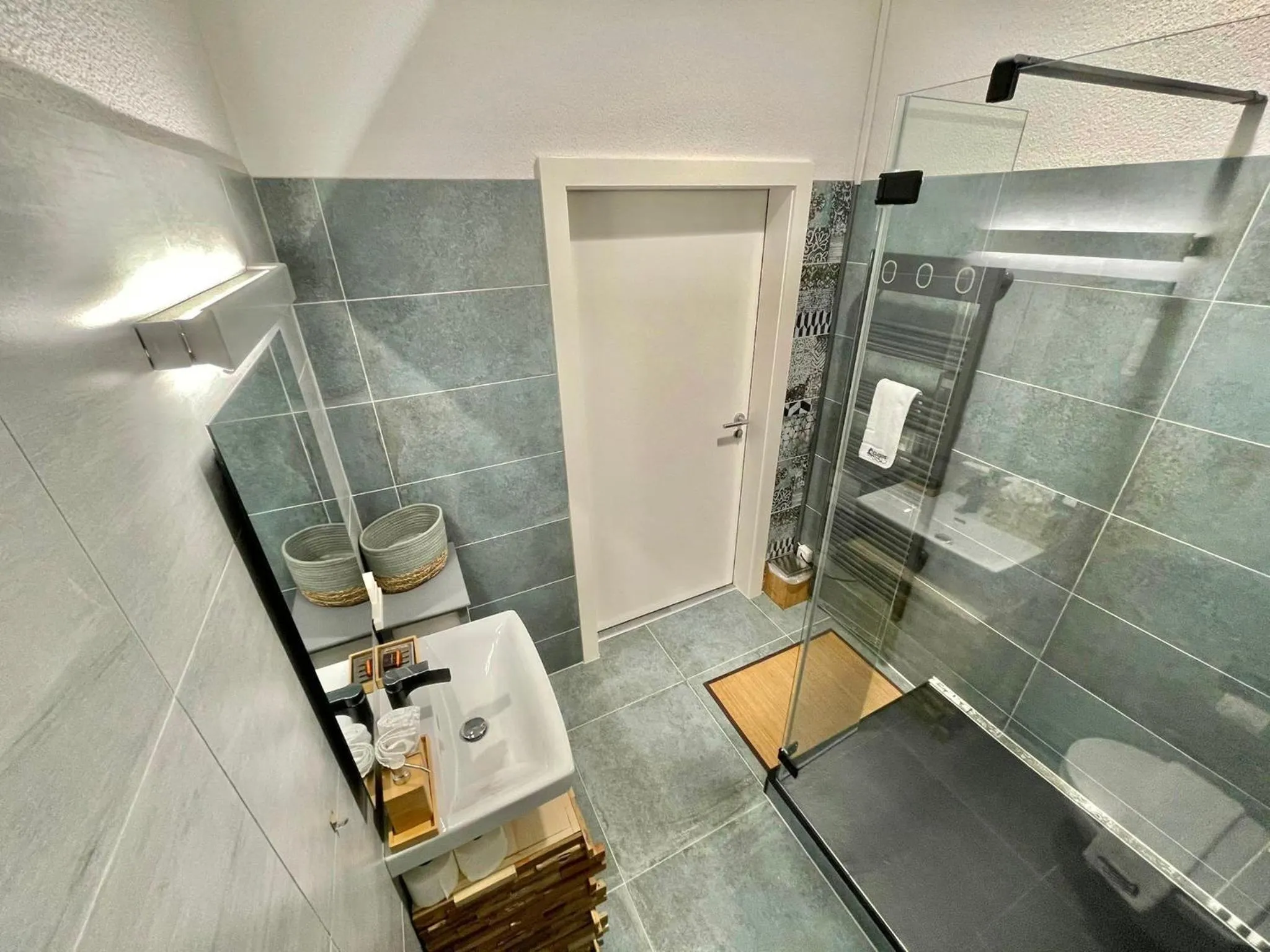 Bathroom in The 5 Continents I by Stay Swiss