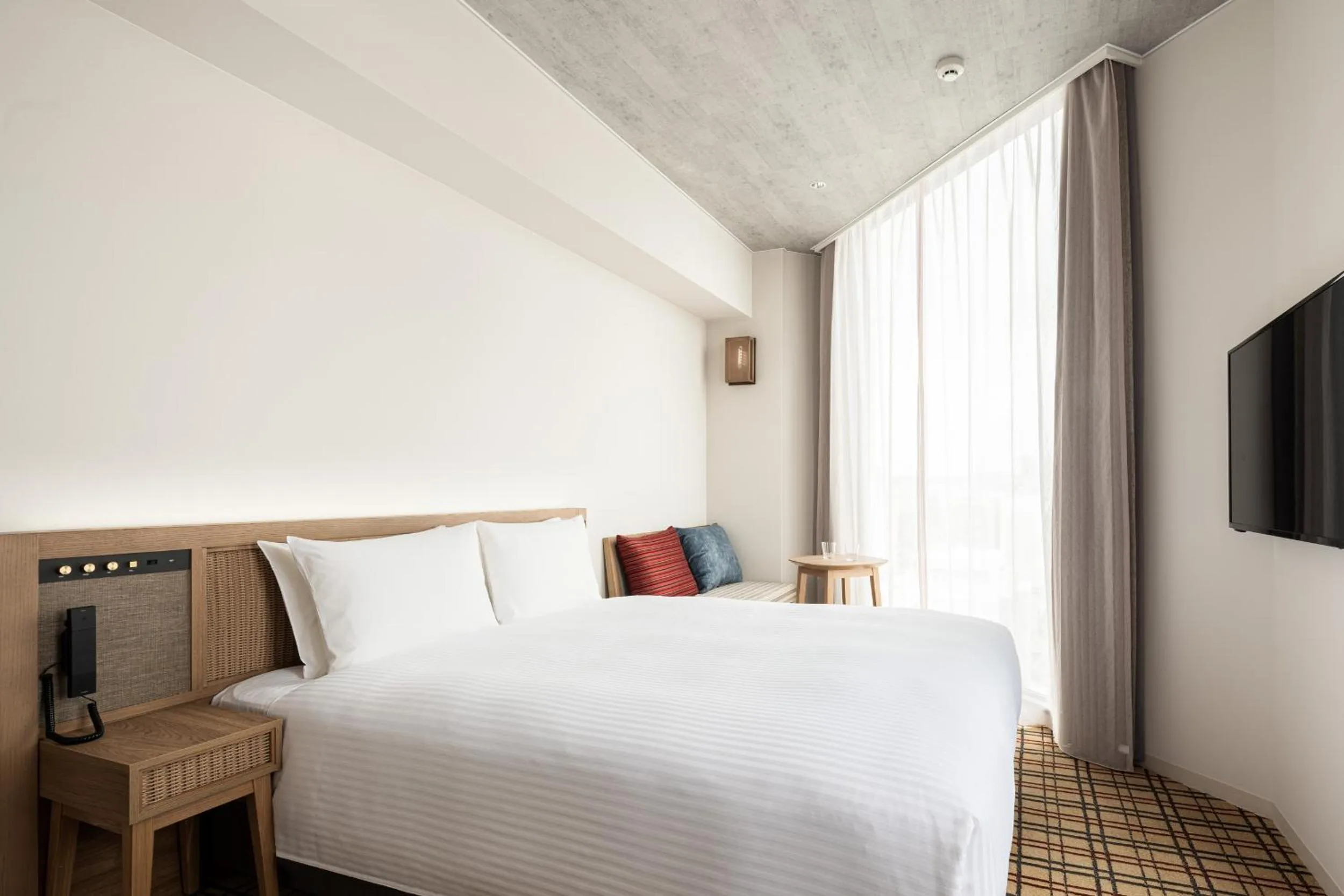 Photo of the whole room, Bed in Nest Hotel Naha Kumoji