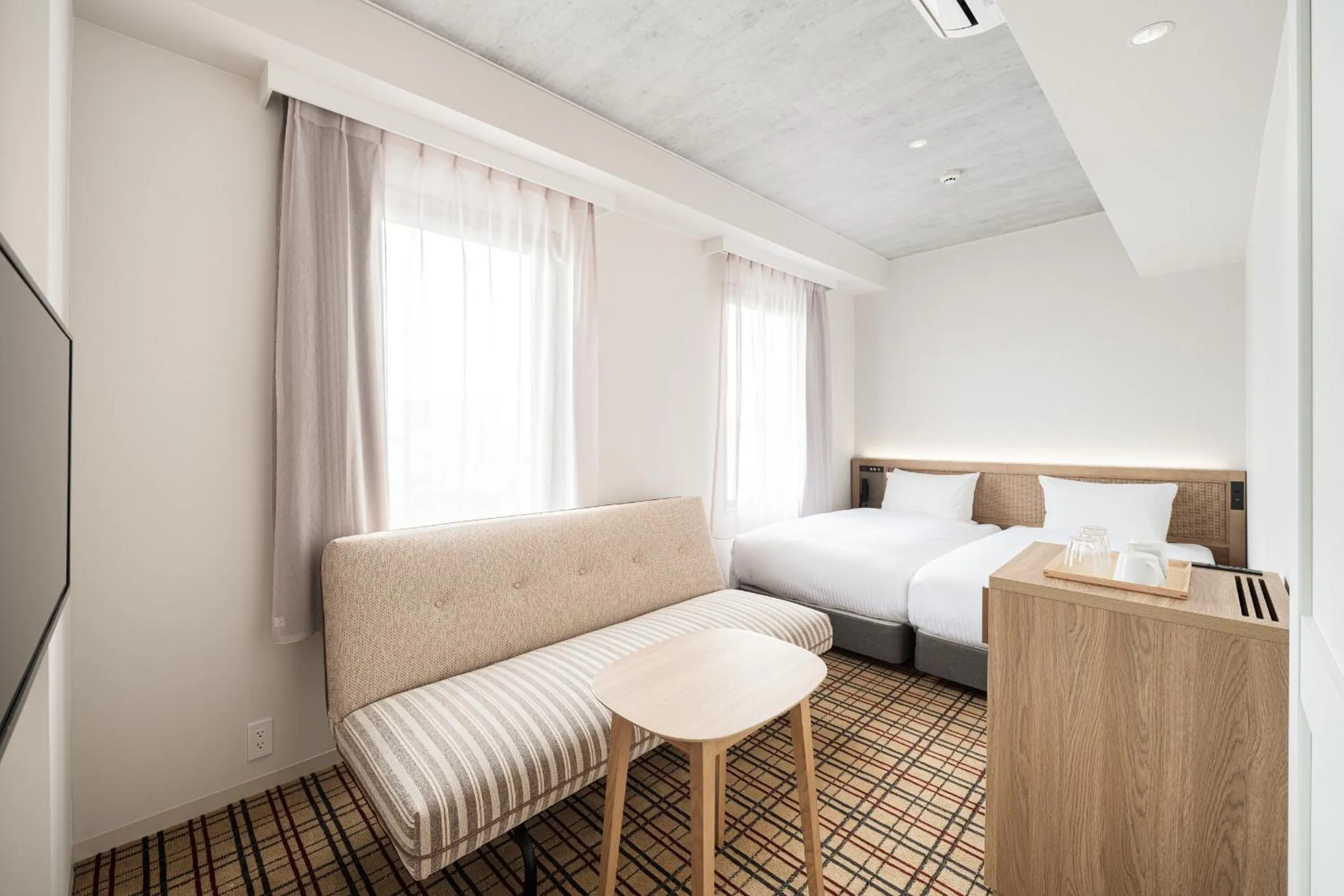 Photo of the whole room, Bed in Nest Hotel Naha Kumoji
