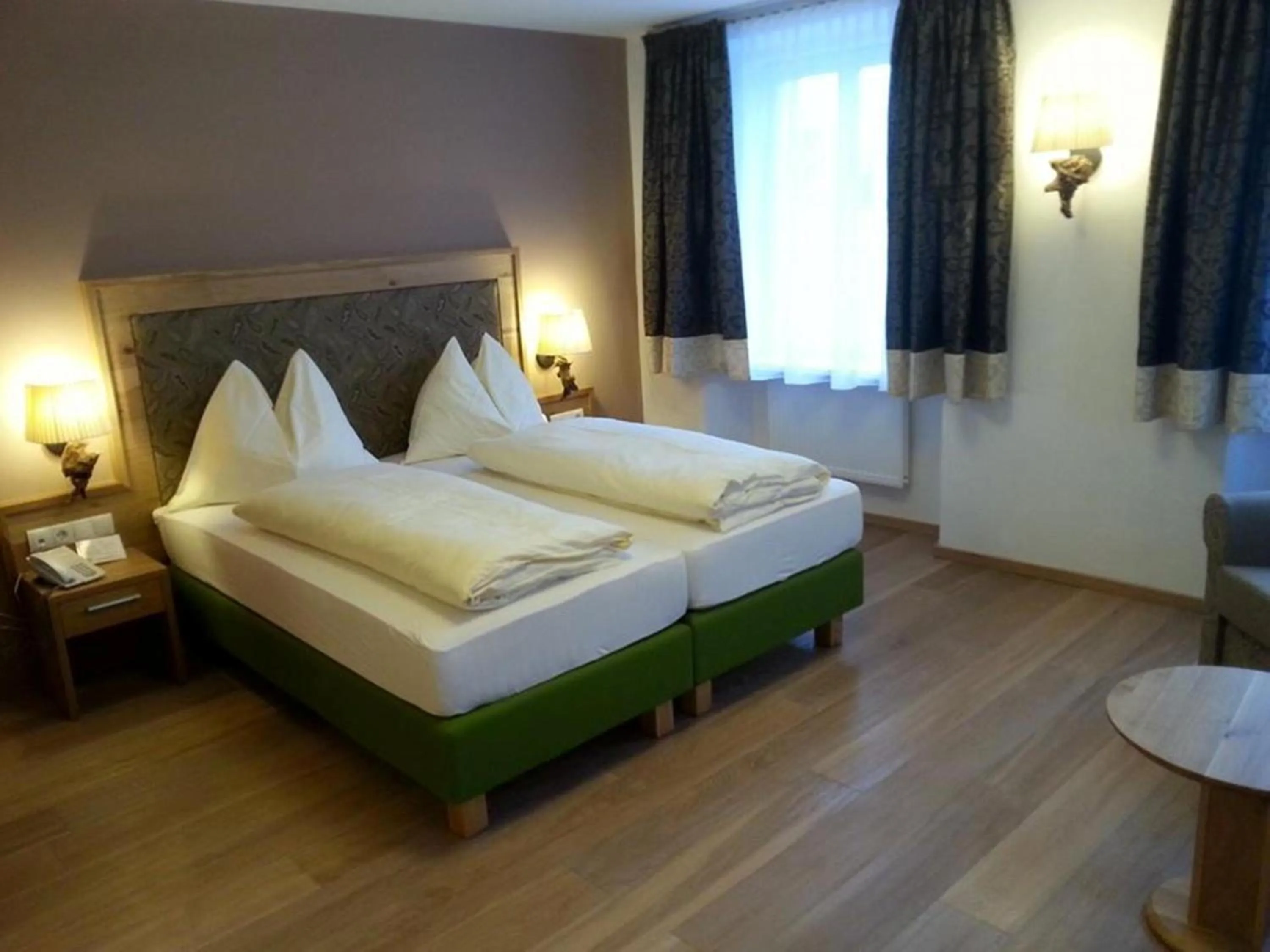 Decorative detail, Bed in Posthotel Radstadt