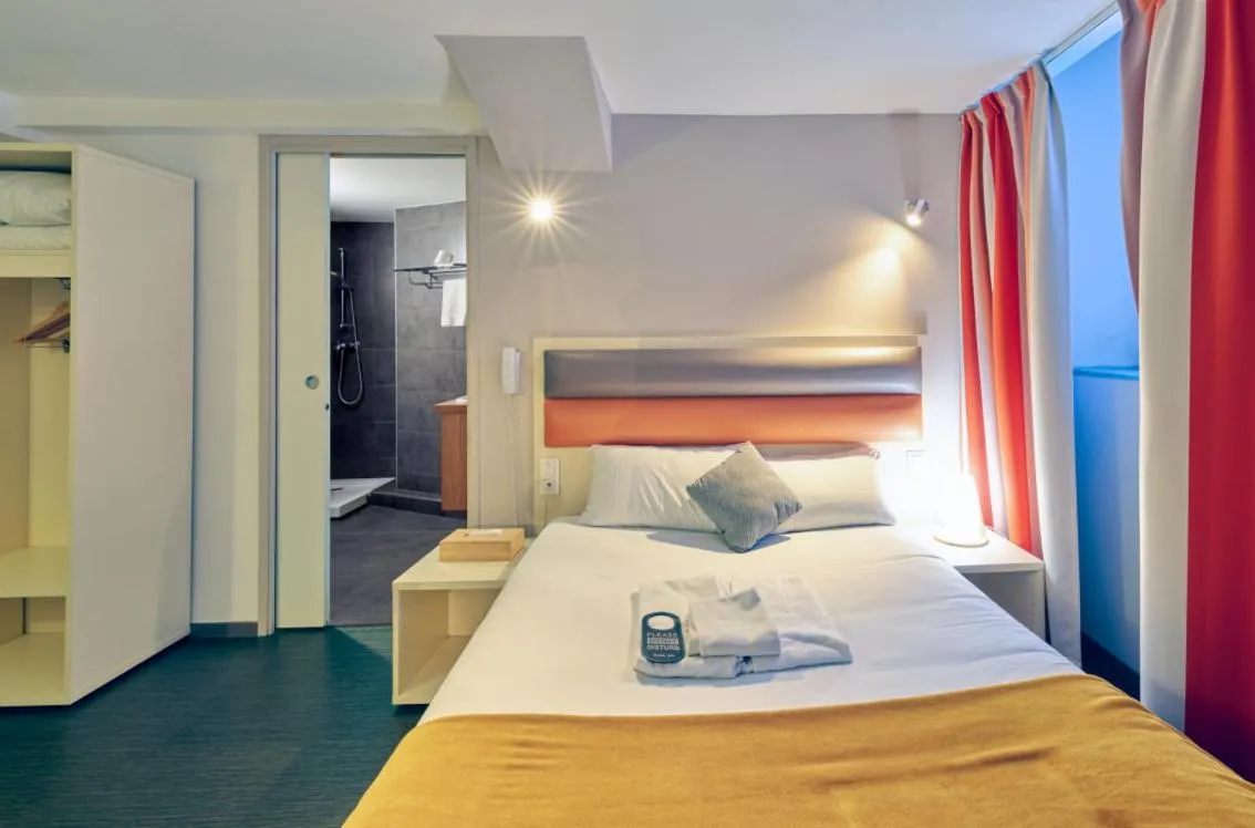 Bed in Adonis Hotel Strasbourg
