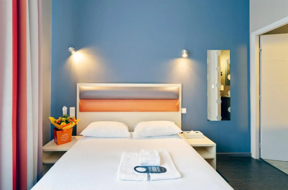 Photo of the whole room, Bed in Adonis Hotel Strasbourg